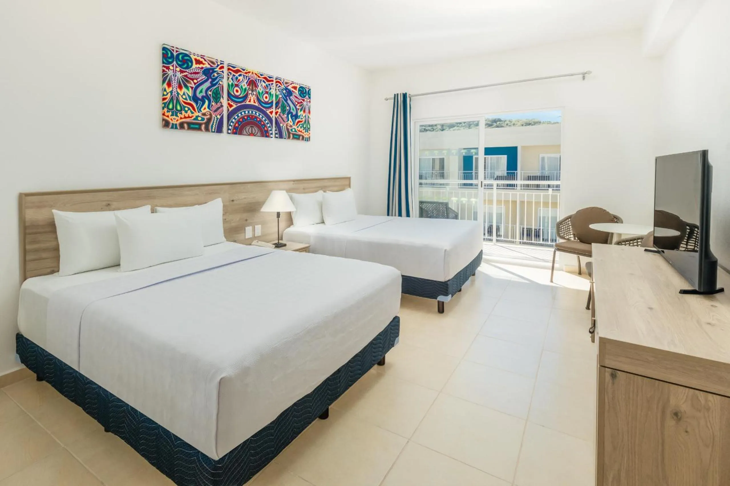 Bed in Decameron La Marina Guayabitos, Ramada All-Inclusive Resort
