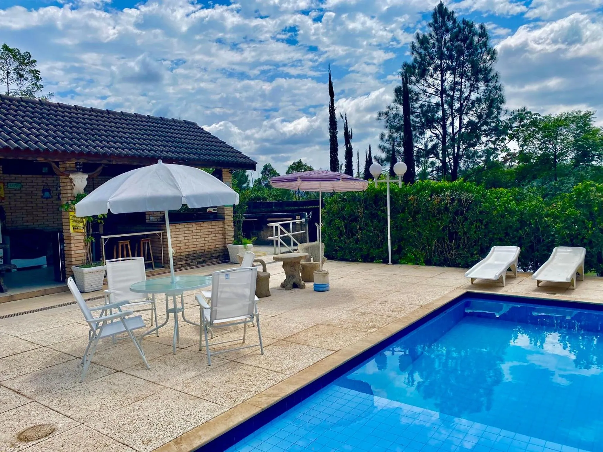 Swimming pool in Chalés Marinelli em São Roque