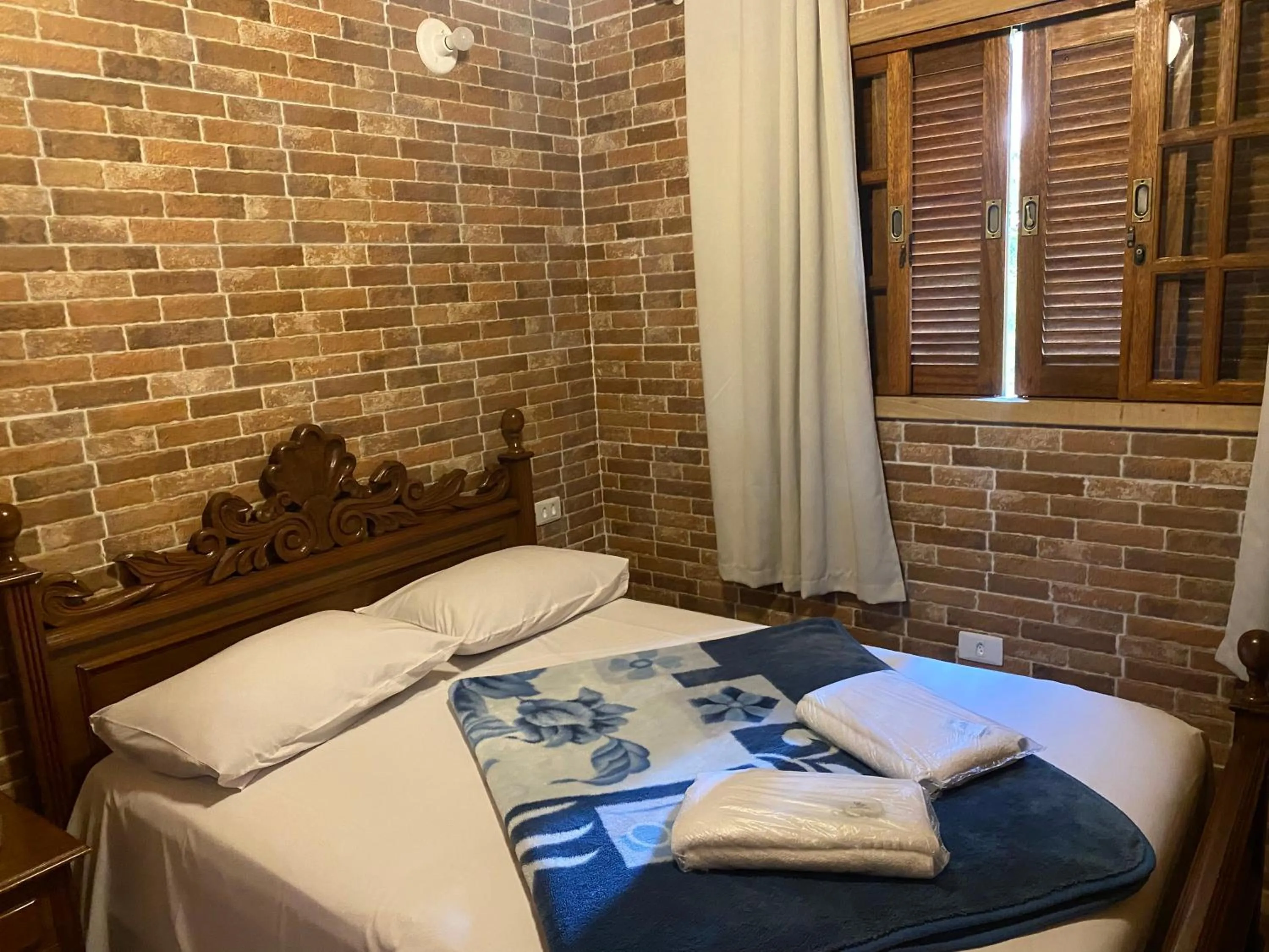 Bed in Chalés Marinelli em São Roque