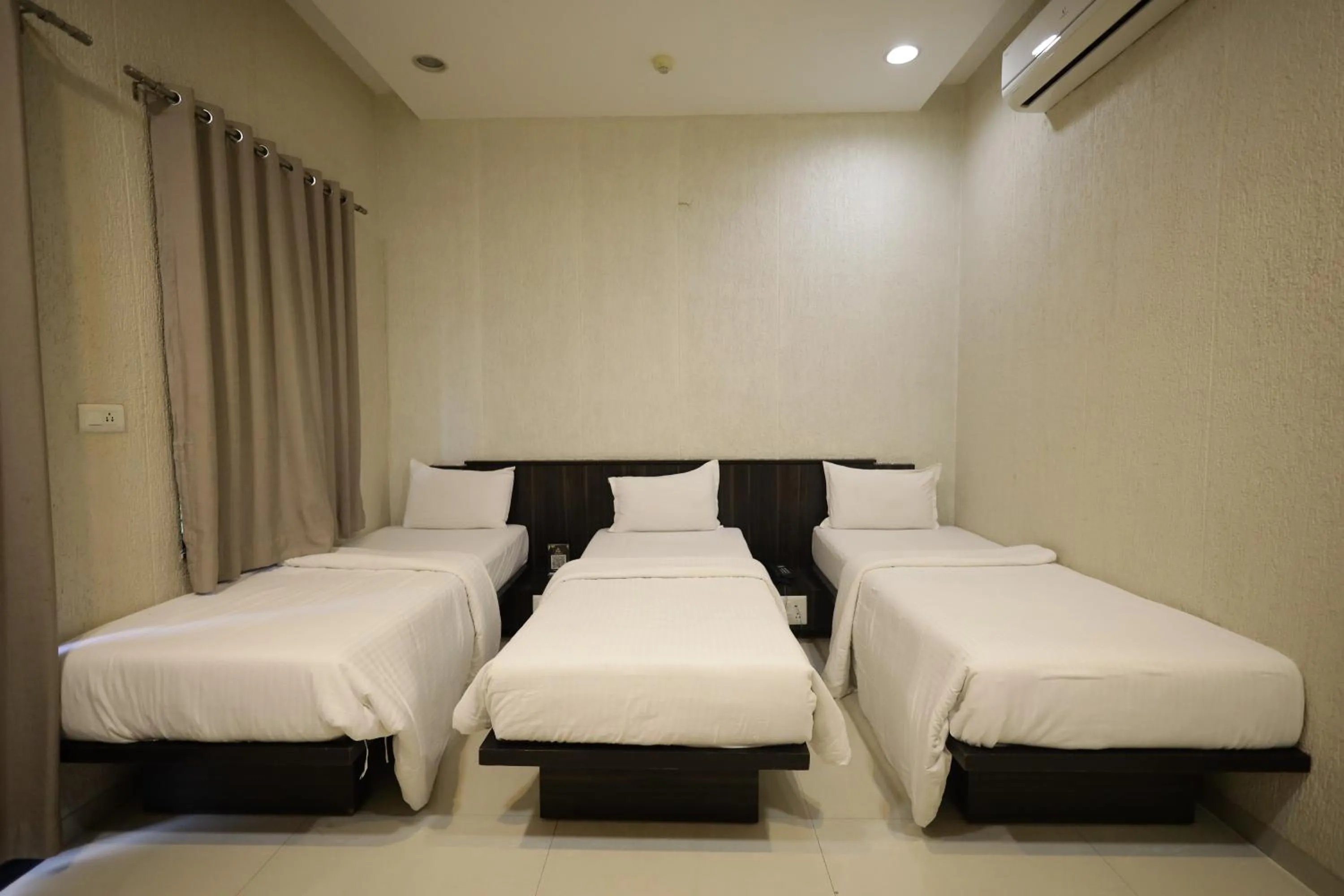 Bed in Hotel President Banquet & Lawn