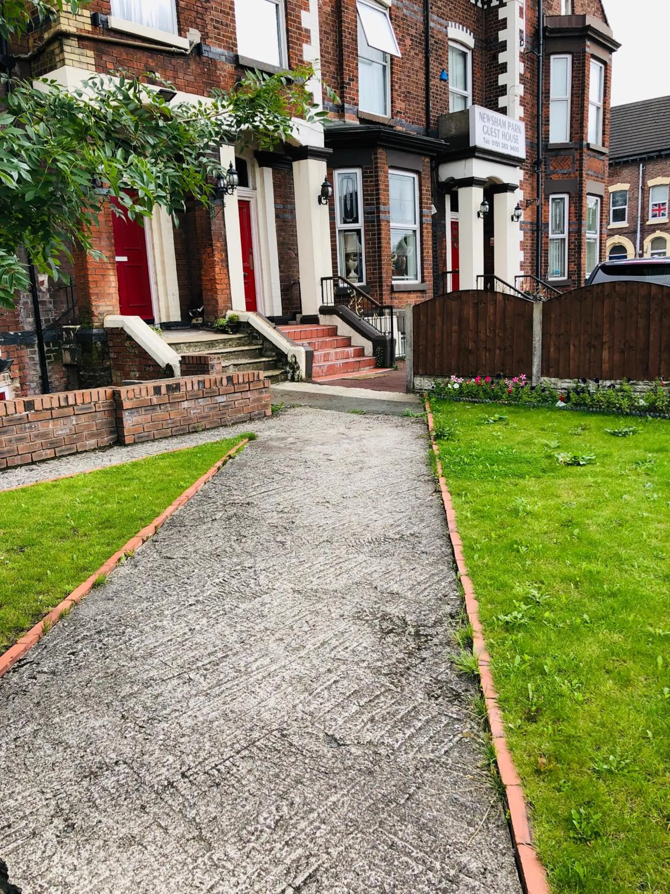 Property building in Castle Lodge Guest House 86-88 Sheil Rd L6 3AF