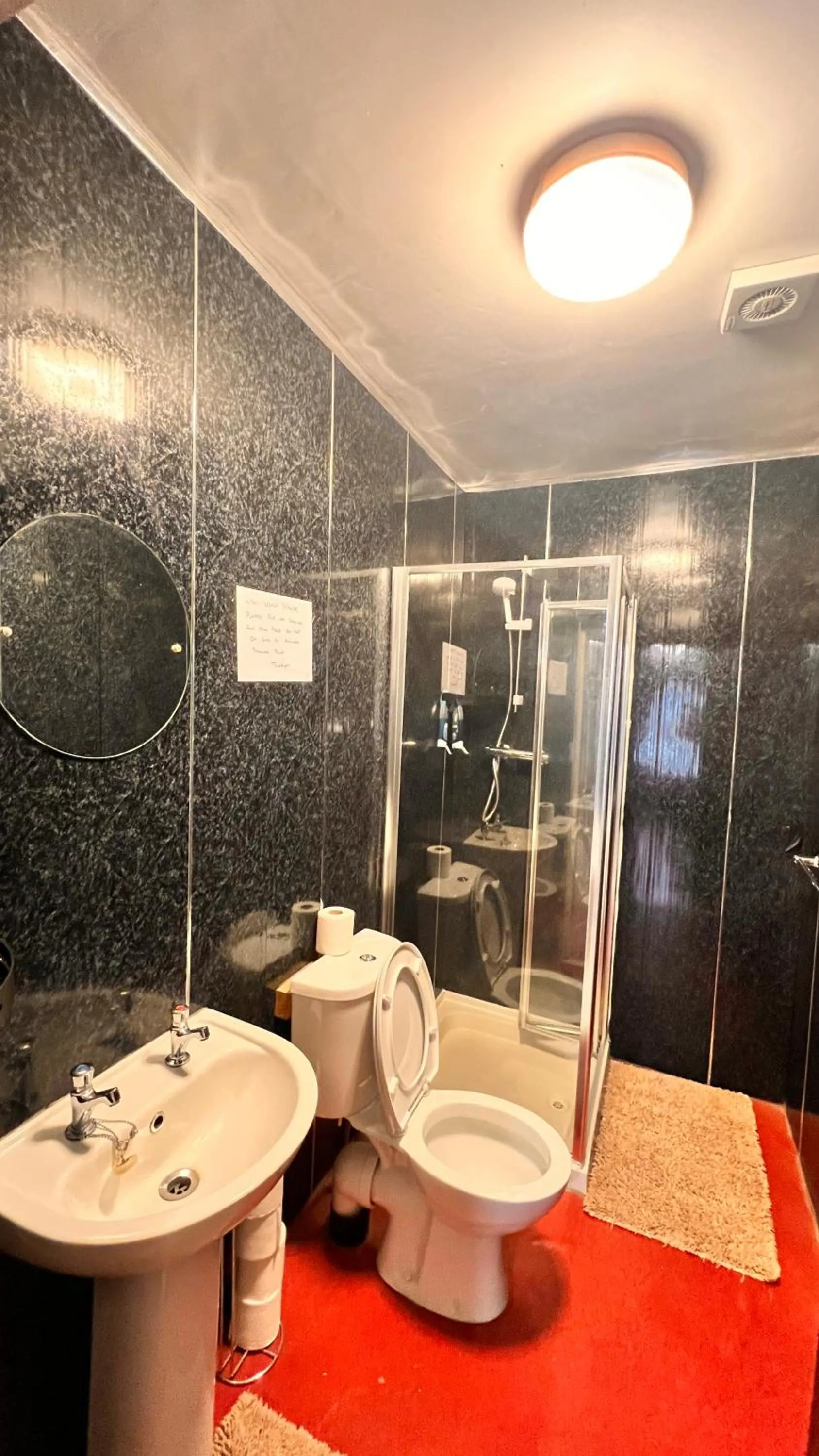 Shower in Castle Lodge Guest House 86-88 Sheil Rd L6 3AF