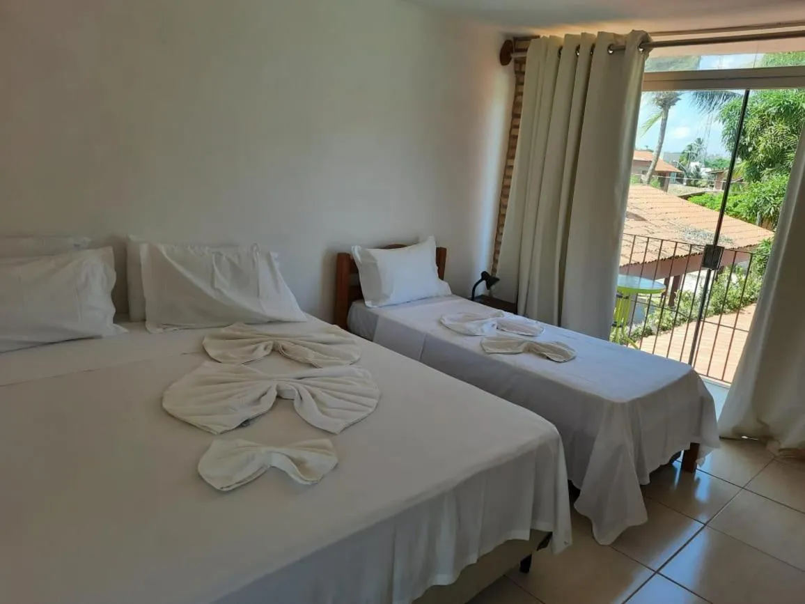 Bed in Pousada Água de Fuego