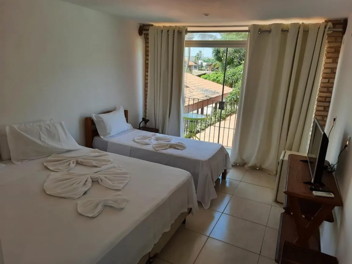 Bed in Pousada Água de Fuego