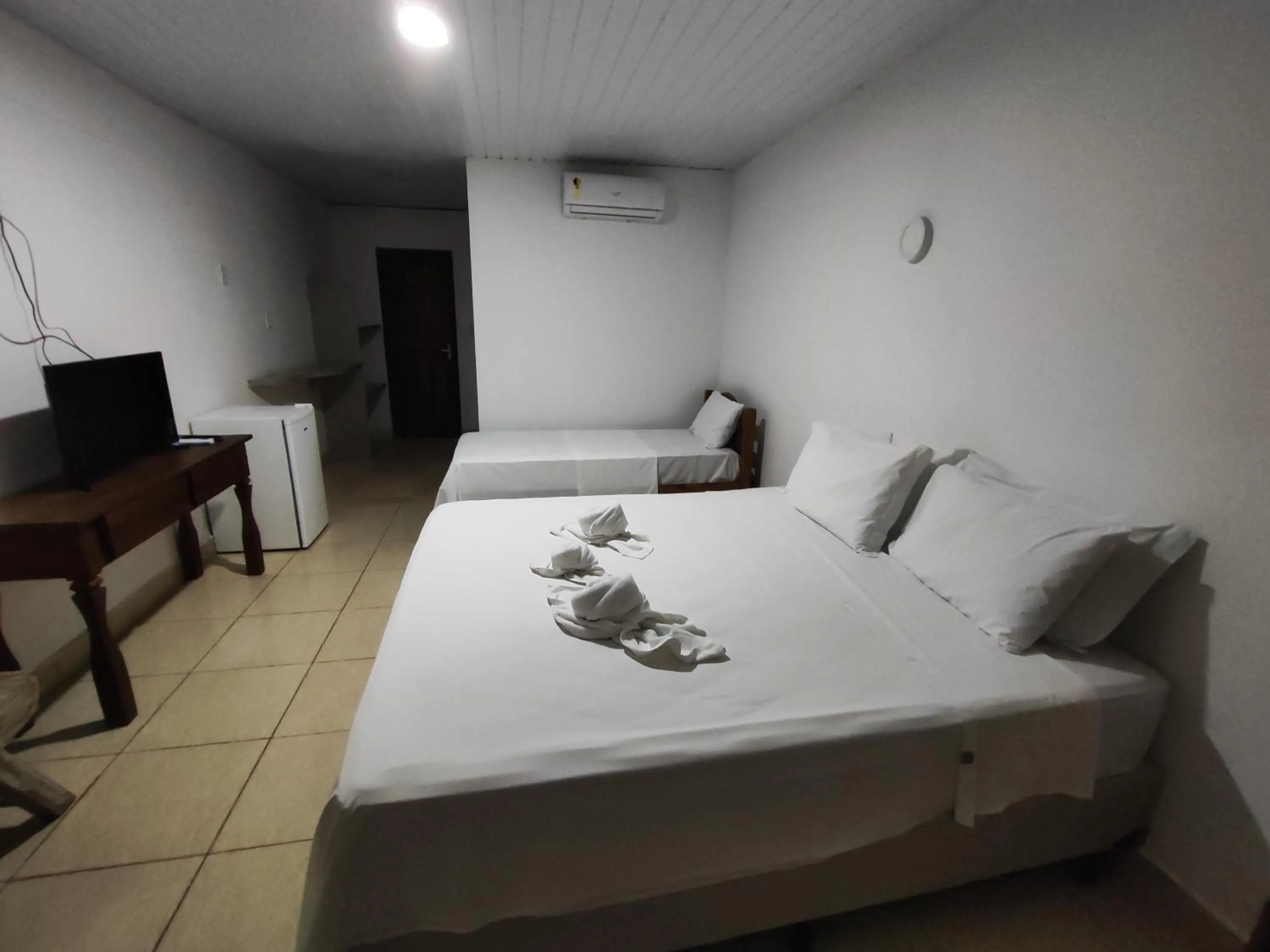 Bed in Pousada Água de Fuego