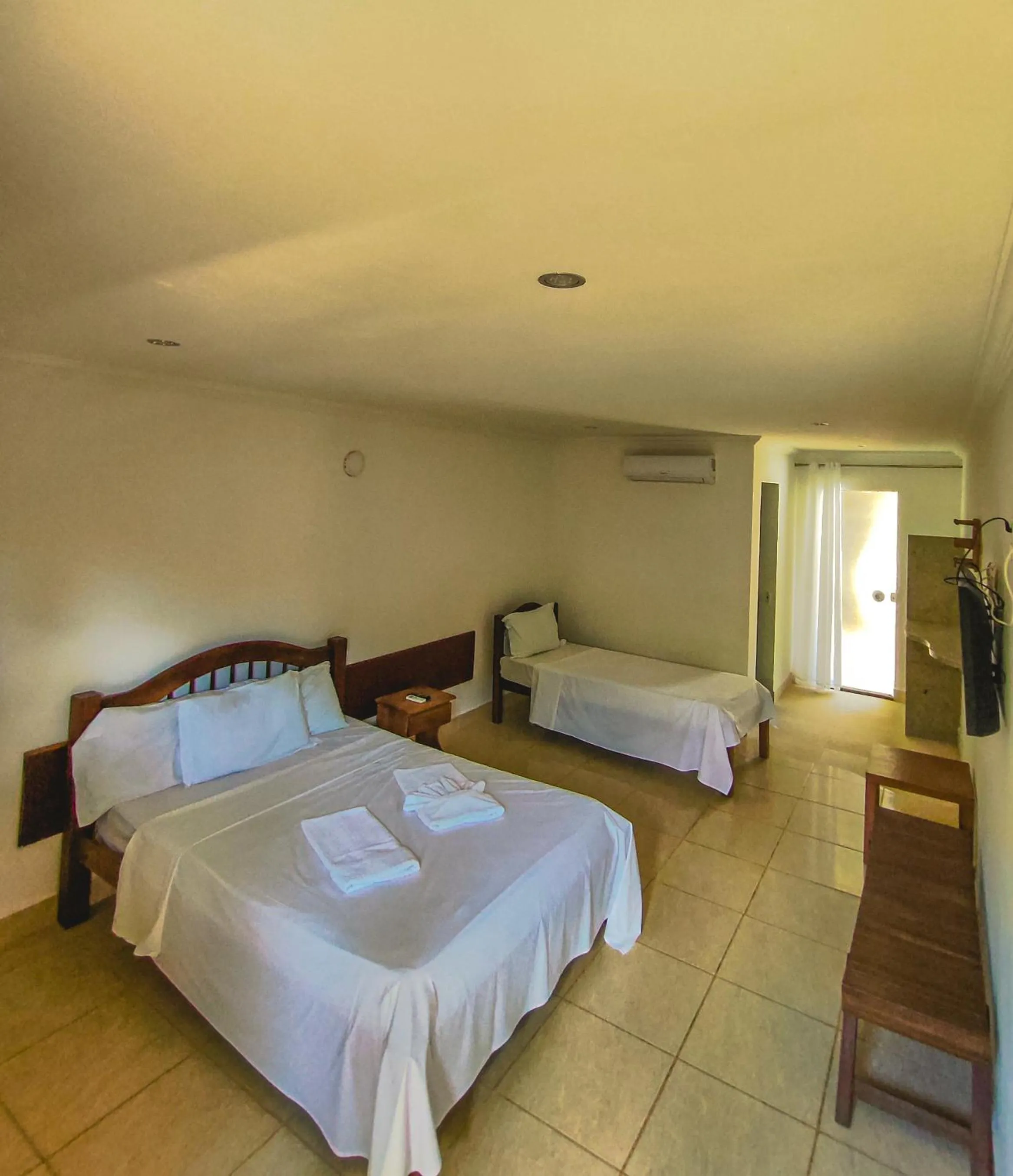 Bed in Pousada Água de Fuego