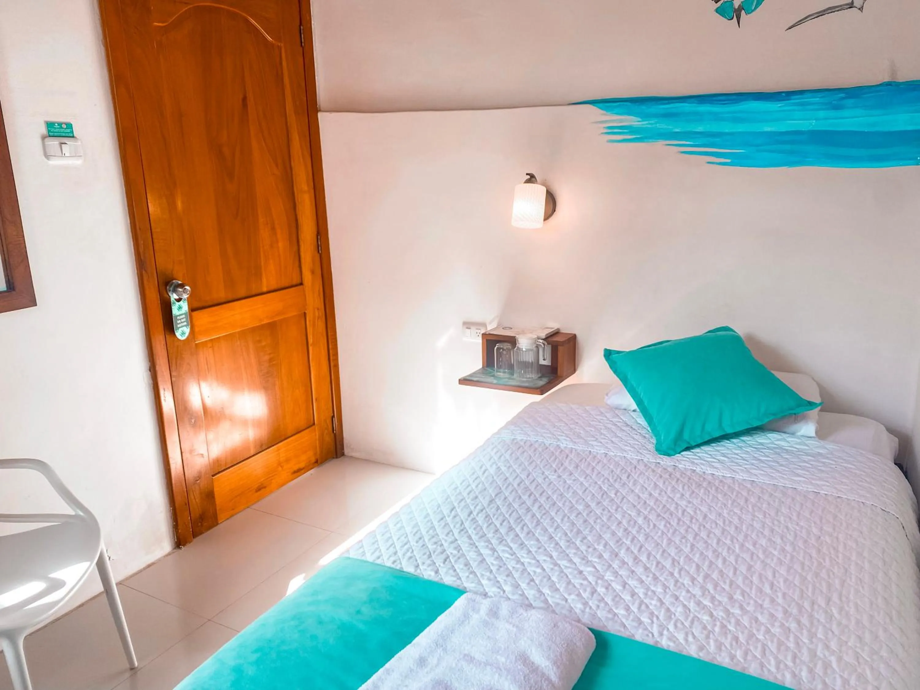 Bed in Hotel Coral Blanco with high speed internet Starlink and Galapagos Tour Operator