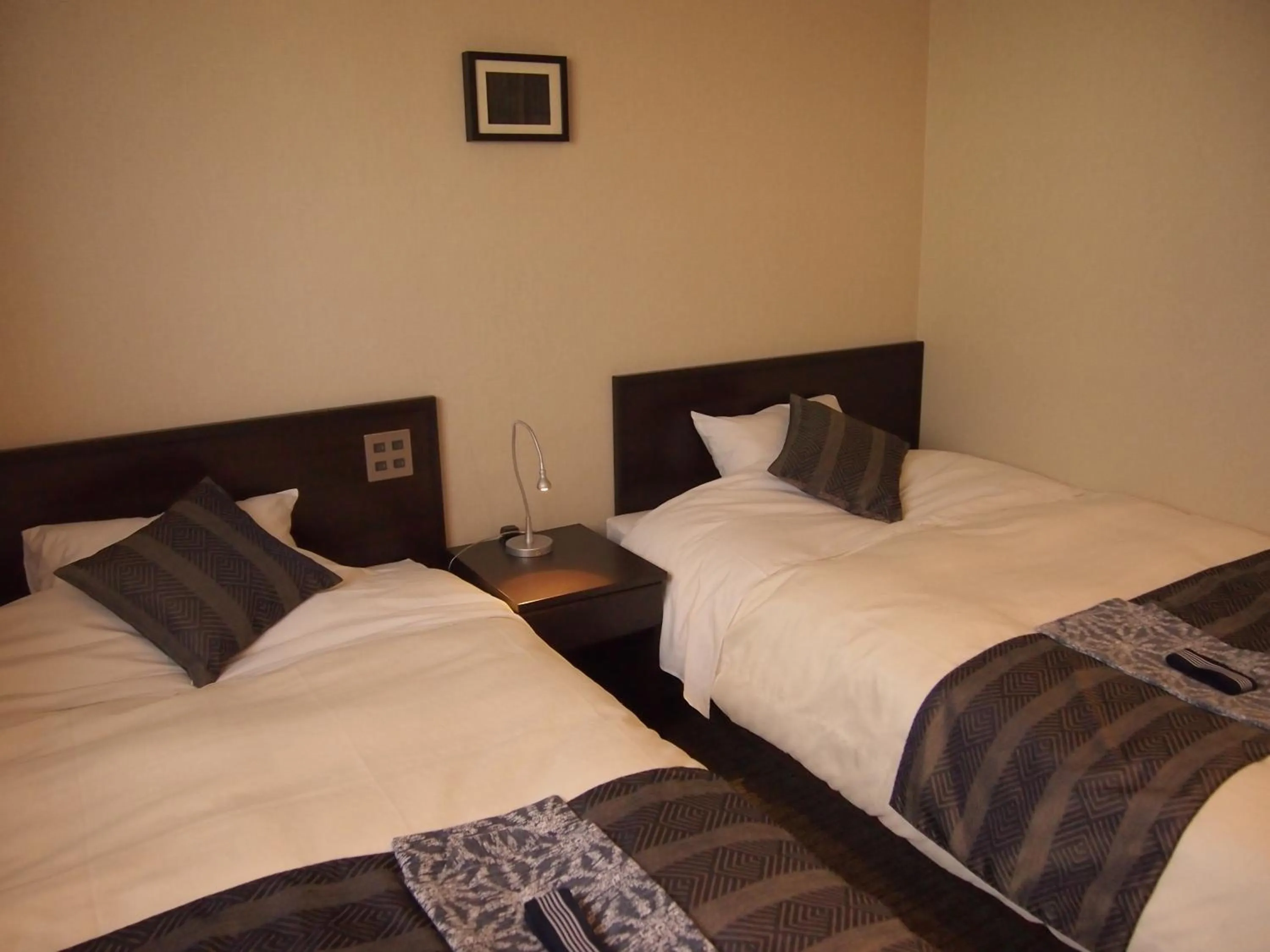 Bed in Silk Inn Kagoshima