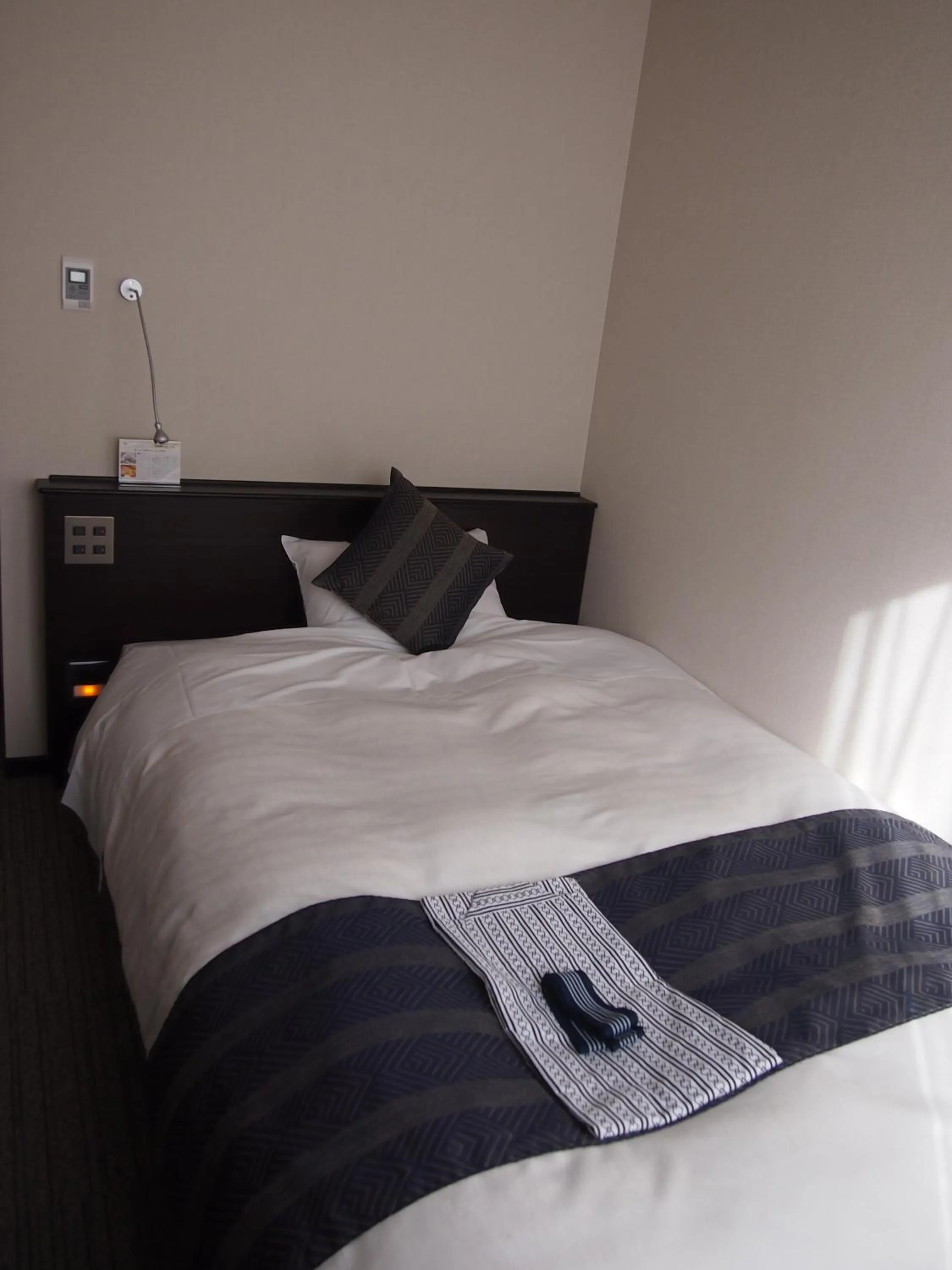 Bed in Silk Inn Kagoshima