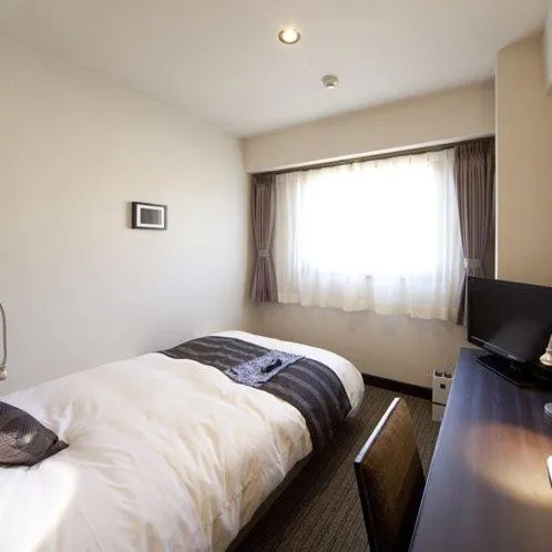 Photo of the whole room, Bed in Silk Inn Kagoshima