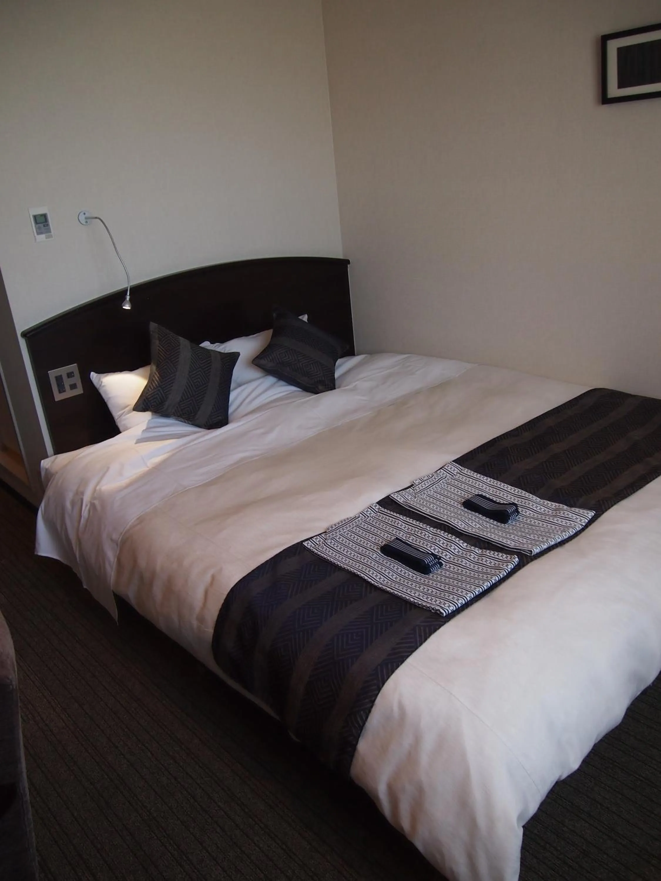 Bed in Silk Inn Kagoshima