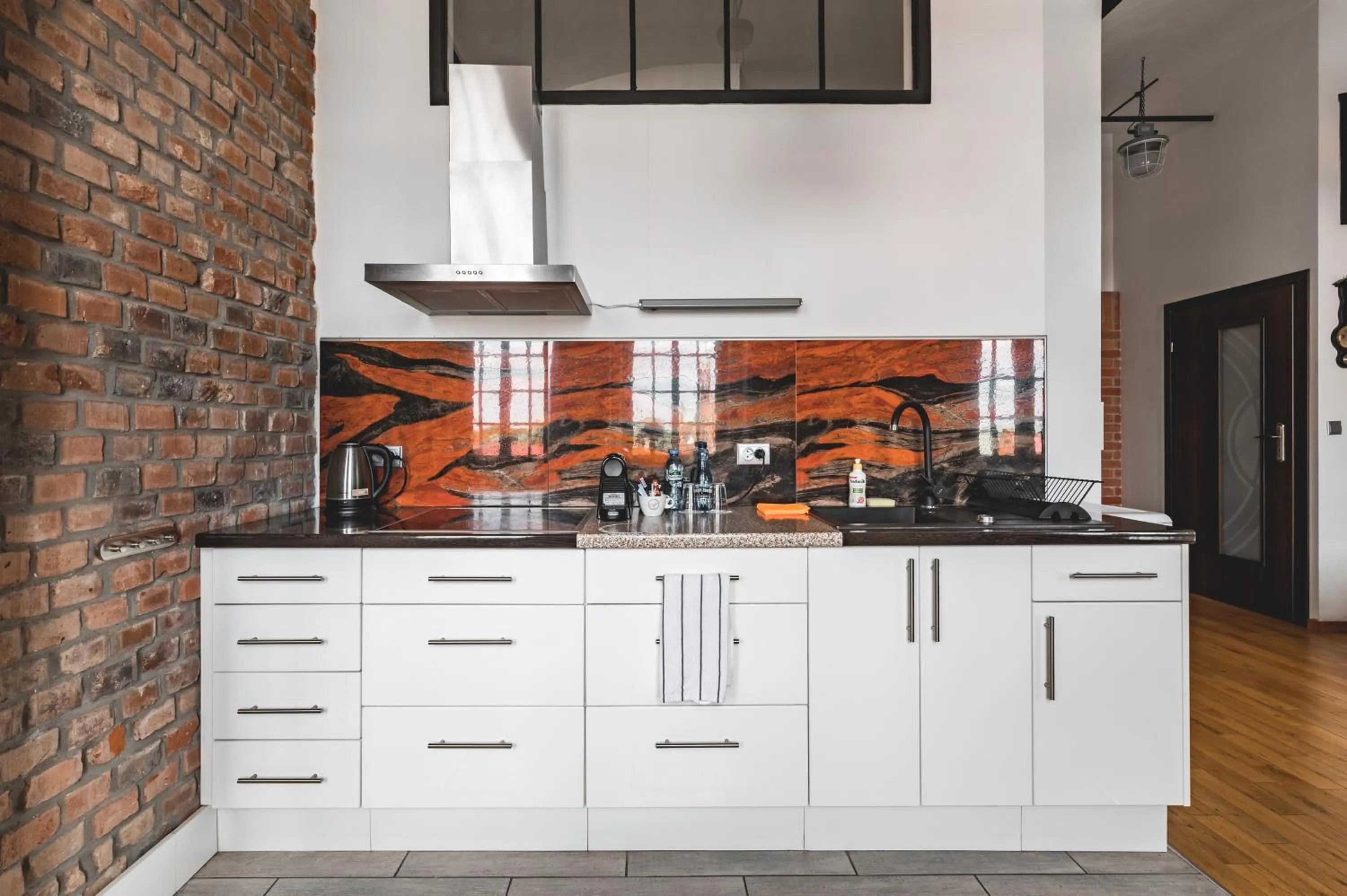 Kitchen or kitchenette in Aparthotel Stara Przędzalnia