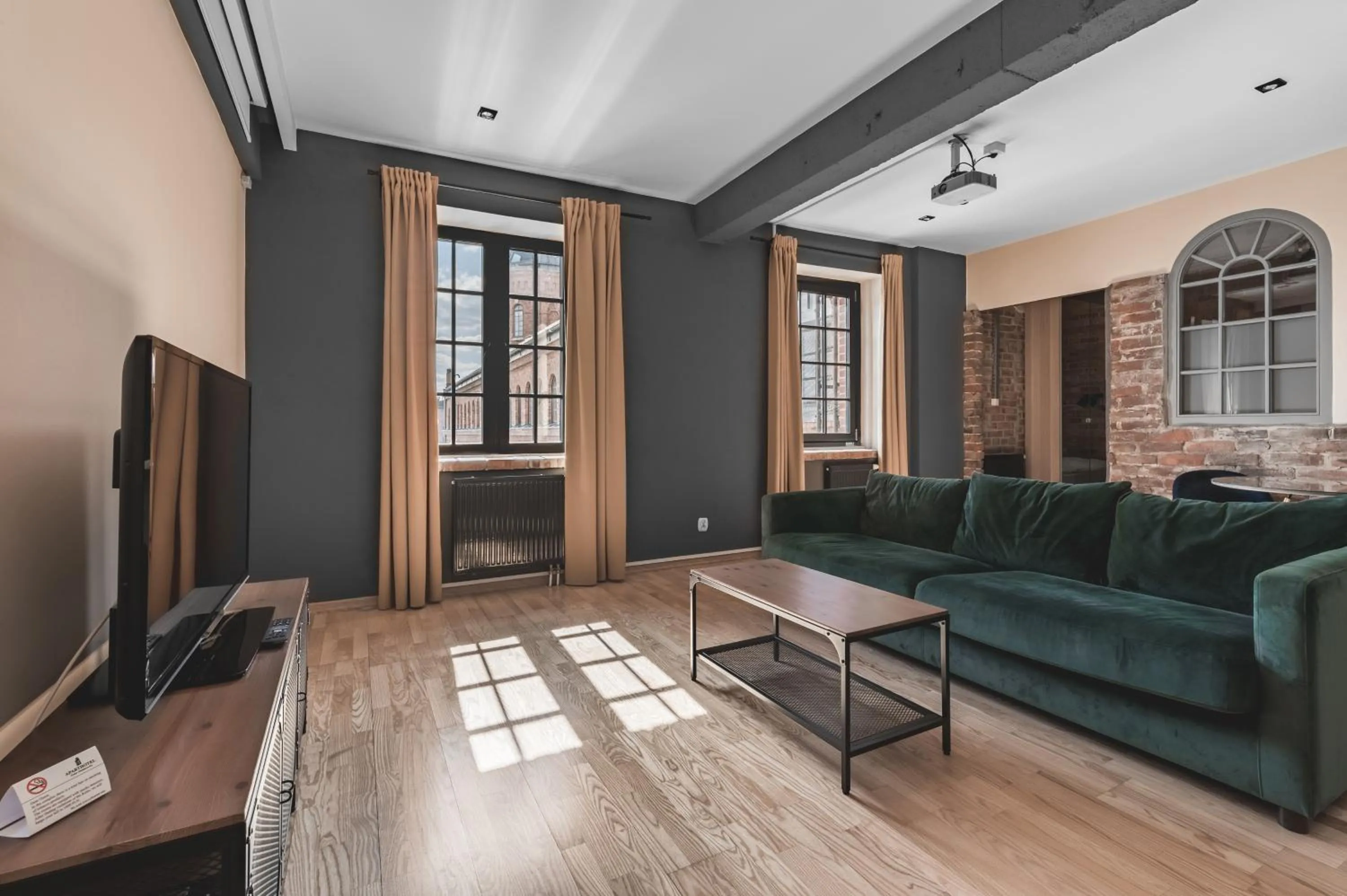 Communal lounge/ TV room in Aparthotel Stara Przędzalnia