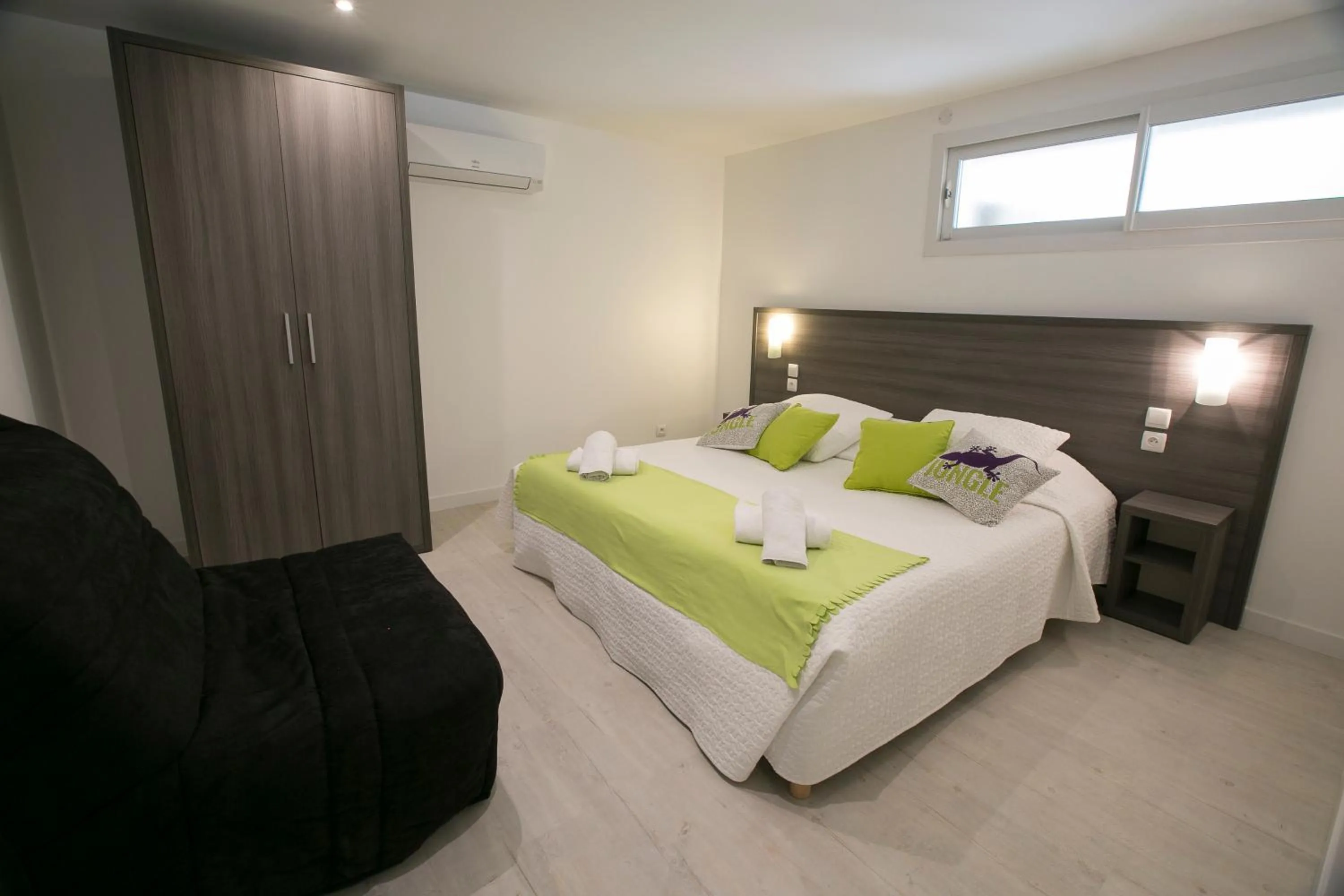 Bedroom, Bed in Le Grand Large Bord de Mer Hotel & Appartements