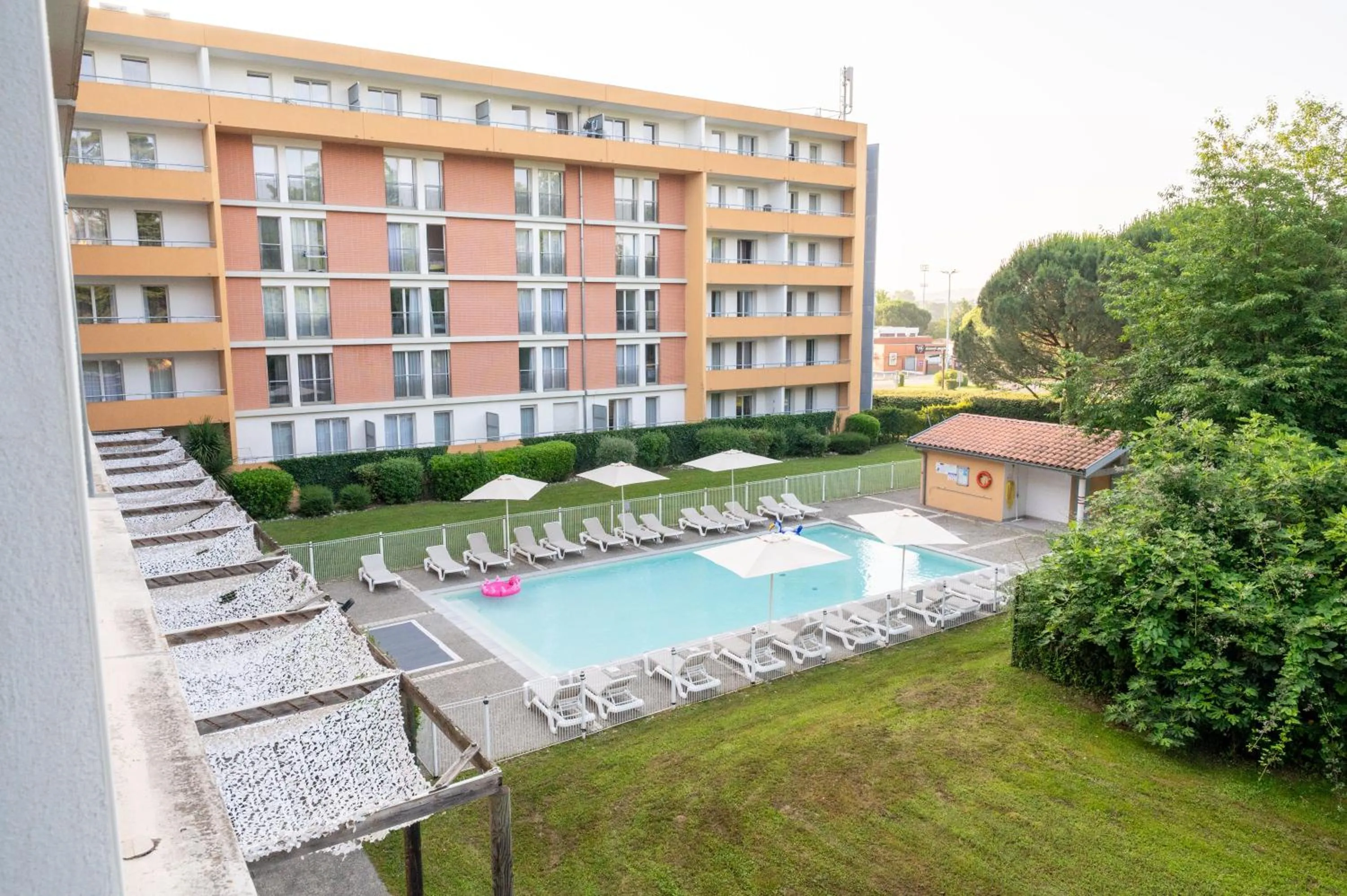 Garden view in Comfort Aparthotel Toulouse Métropole