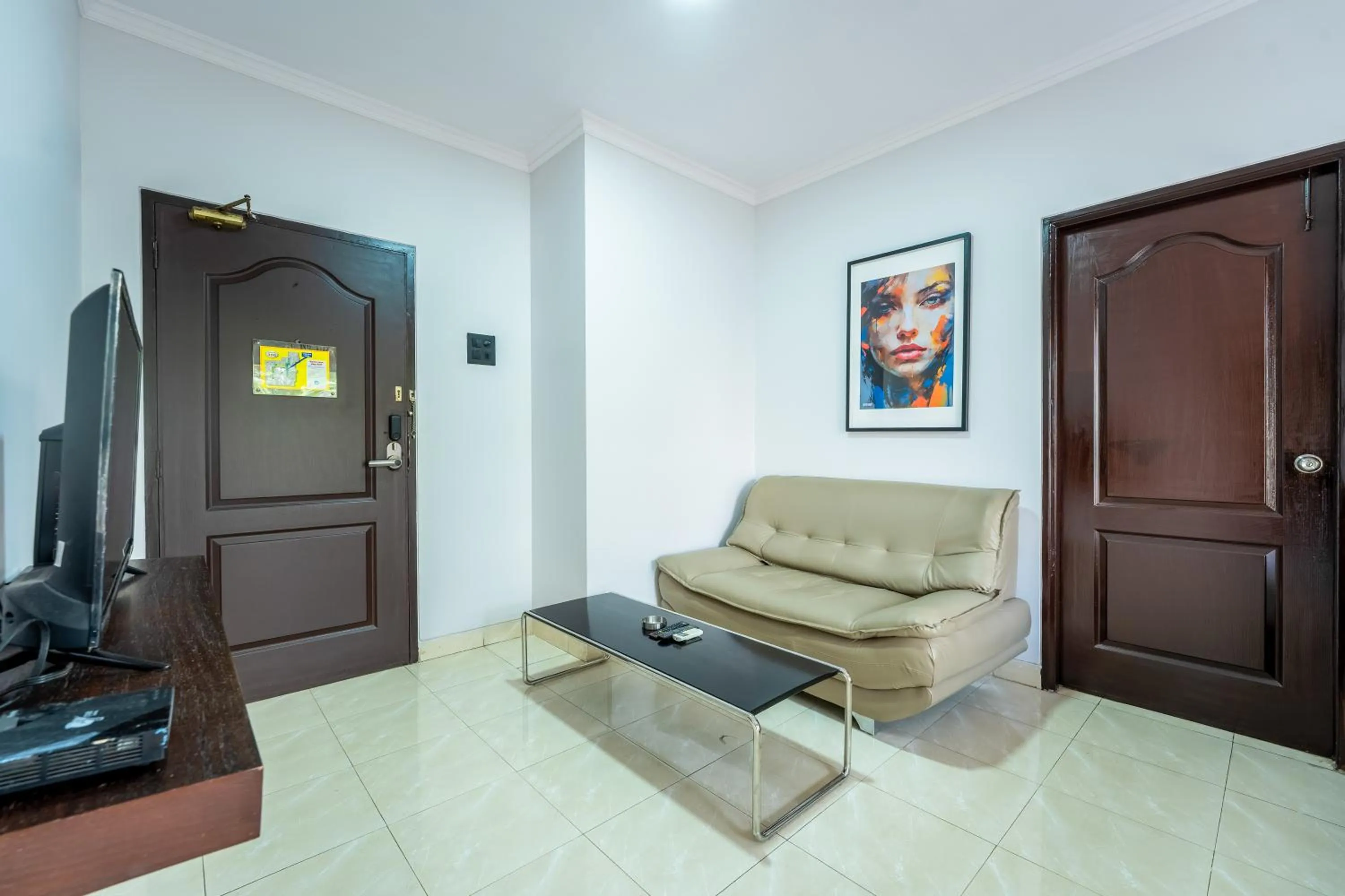 Seating area in asar Landmark Suites Mumbai International Airport by Orion Hotels