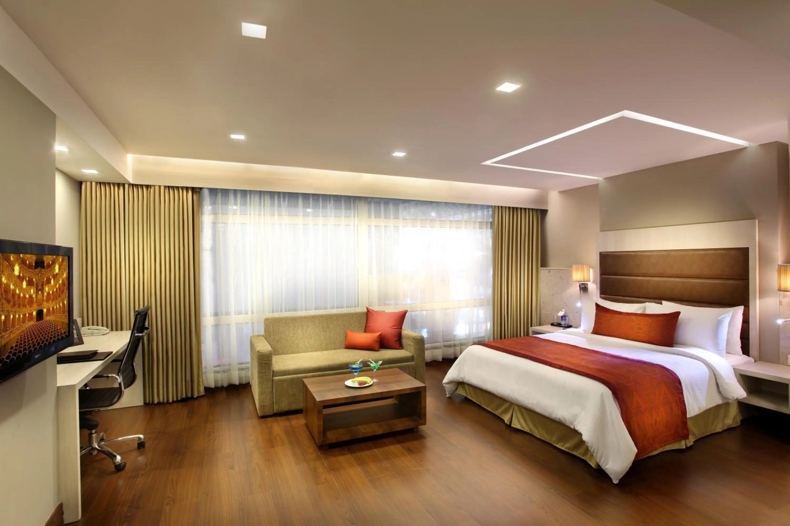Photo of the whole room, Bed in Mahagun Sarovar Portico Suites