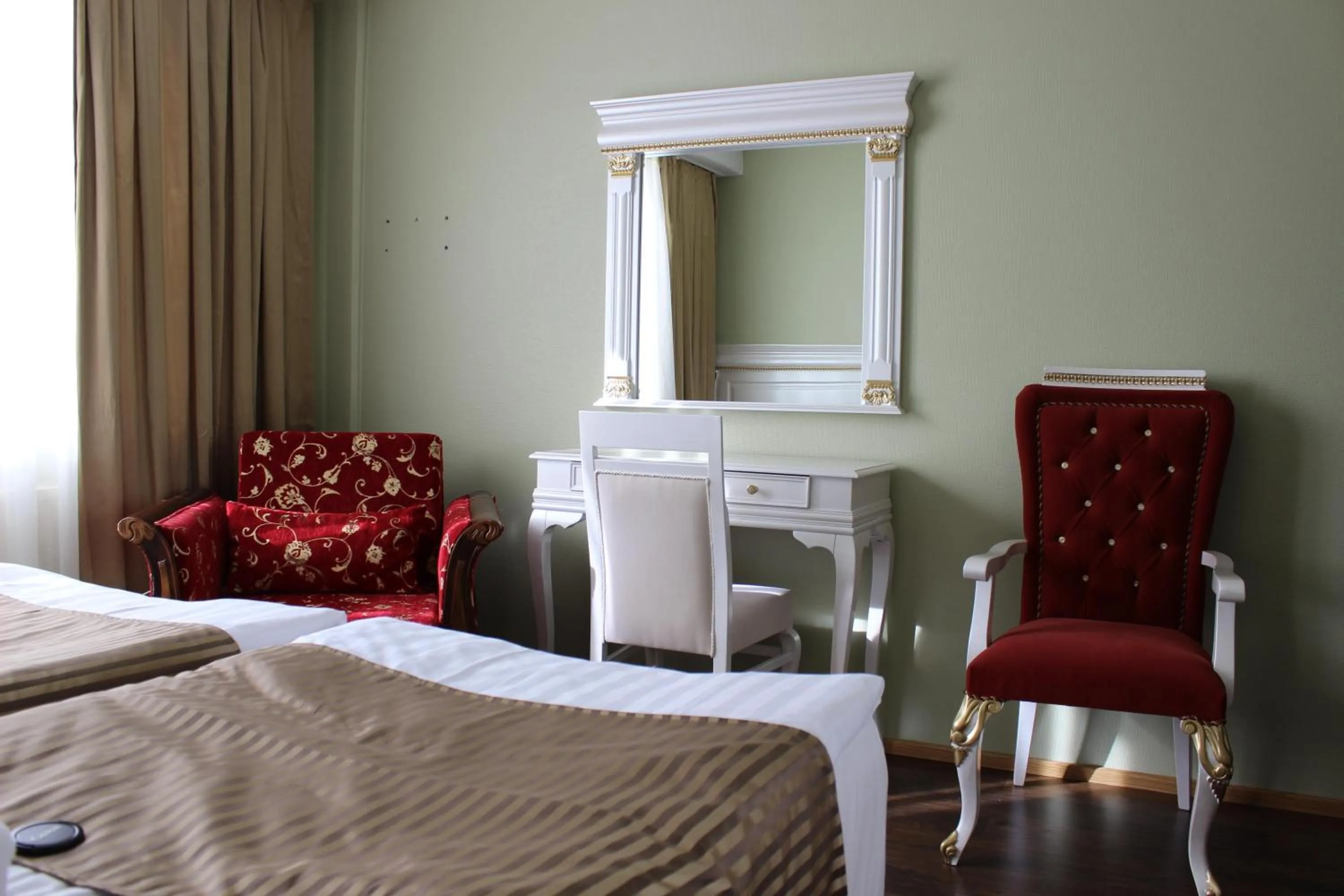 Seating area, Bed in Hotel Golden Dome Iisalmi