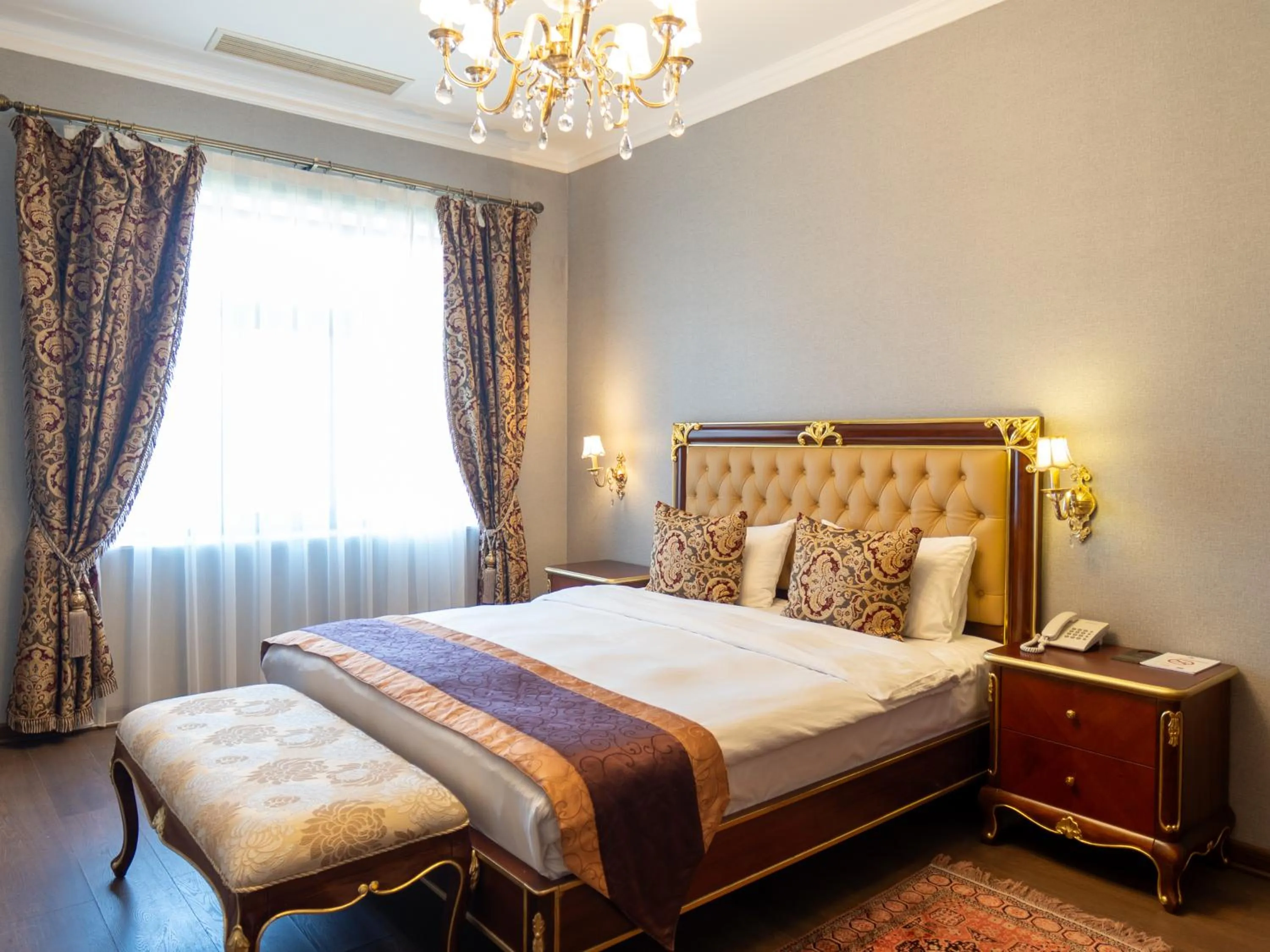 Bed in Shah Palace Luxury Museum Hotel