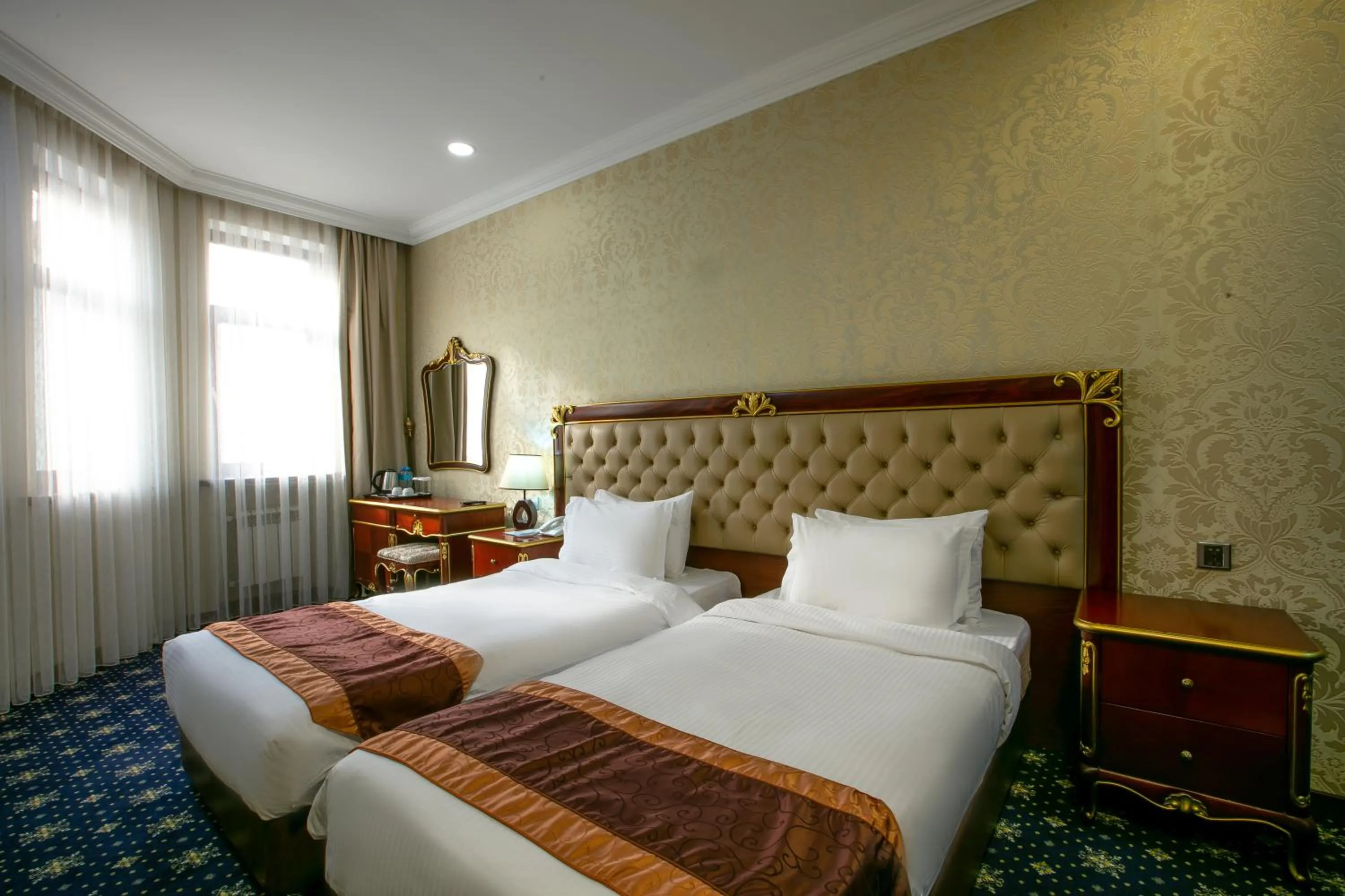 Bed in Shah Palace Luxury Museum Hotel