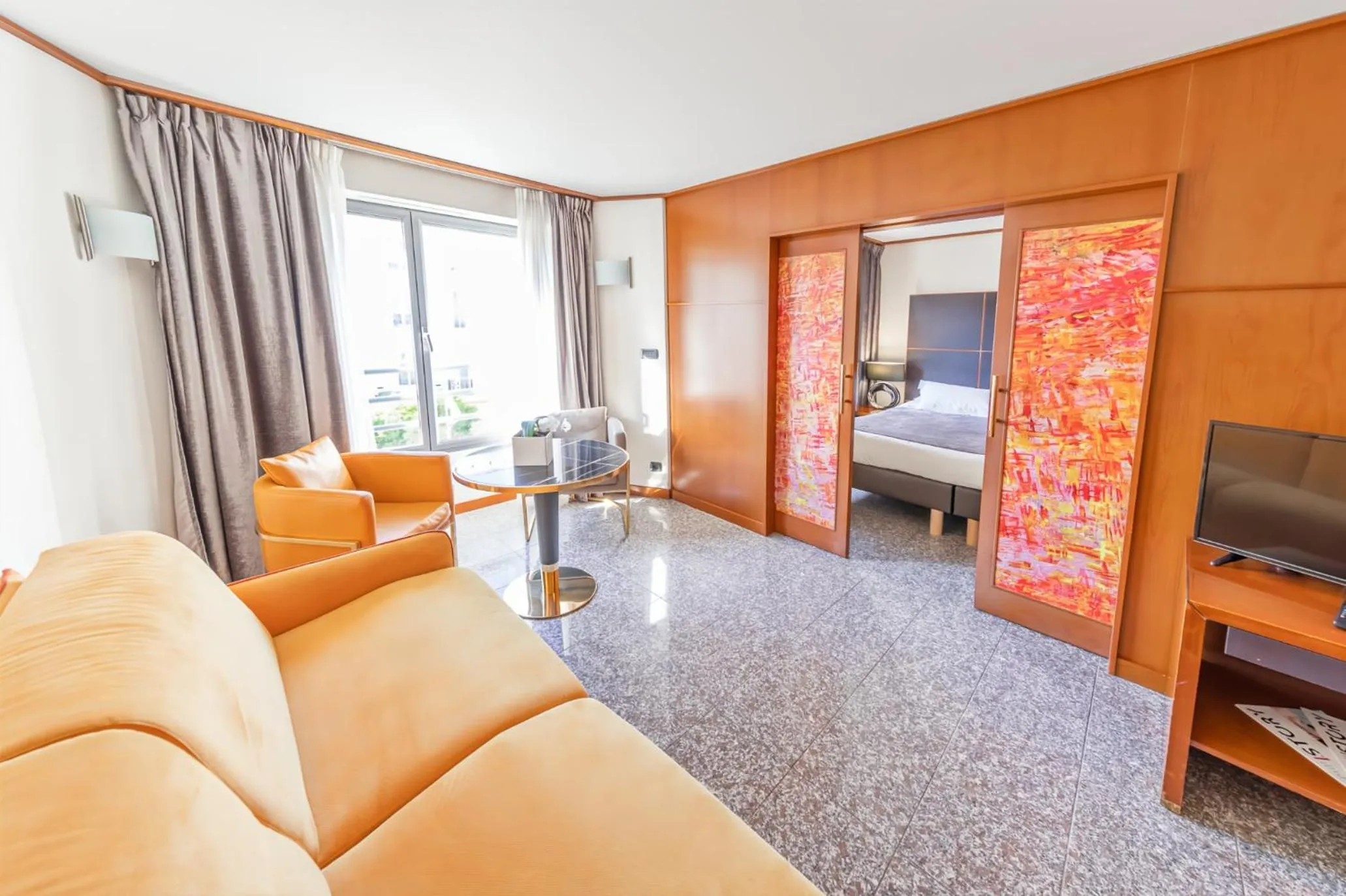 Communal lounge/ TV room, Bed in Goldstar Apartments & Suites