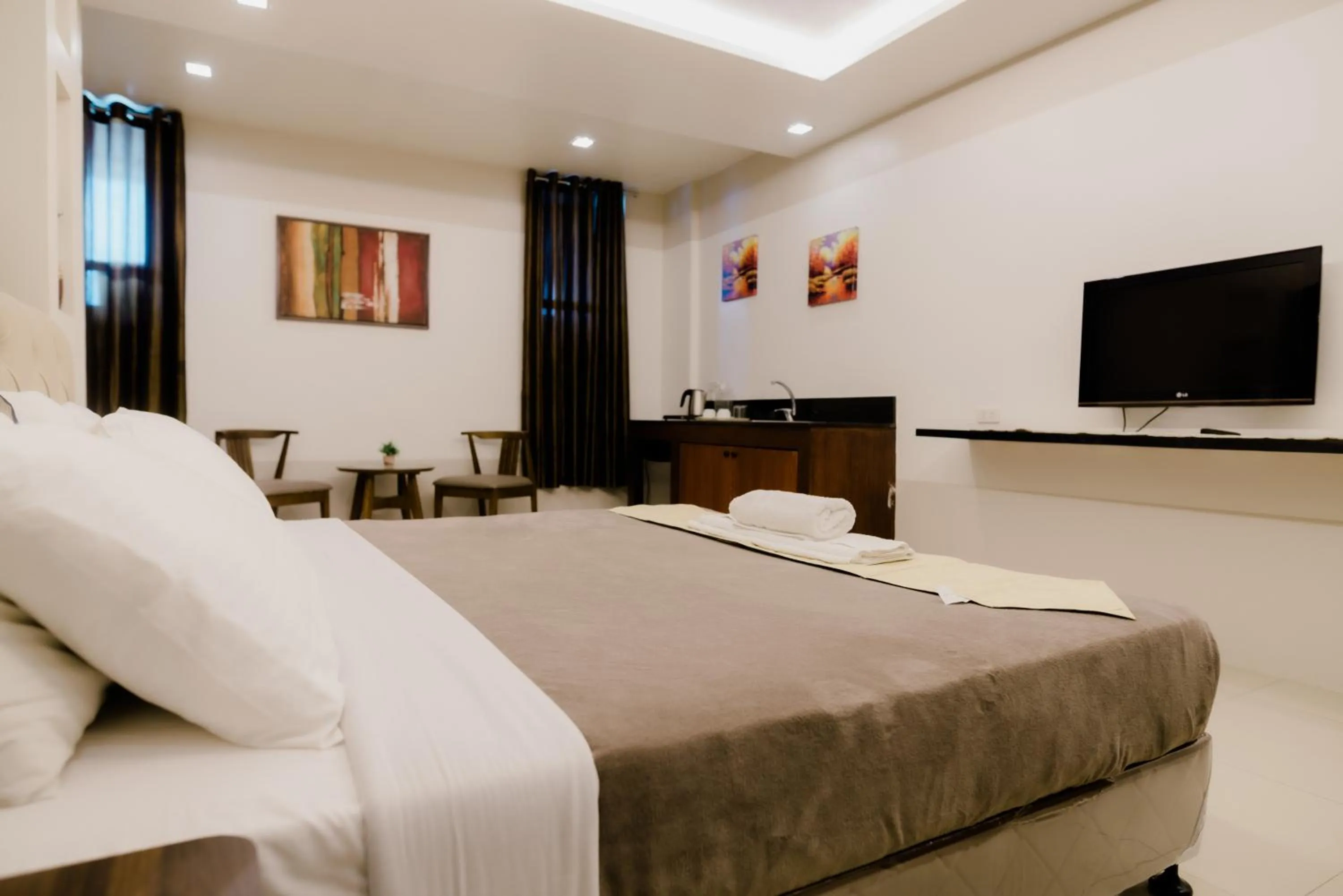 Photo of the whole room, Bed in The Horizon Suites and Arcade