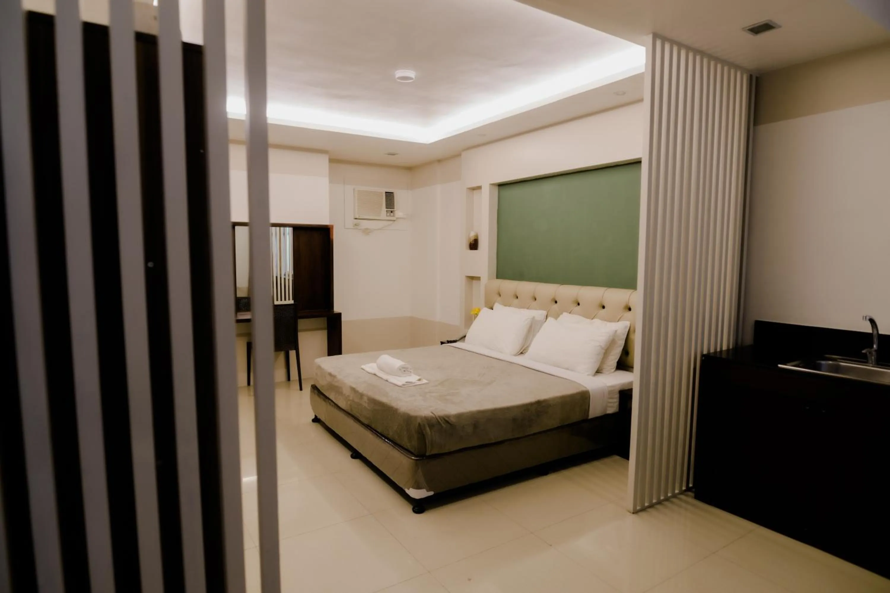 Photo of the whole room, Bed in The Horizon Suites and Arcade