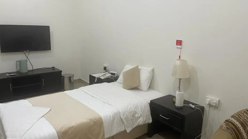 Bed in Arabian Palm Hotel