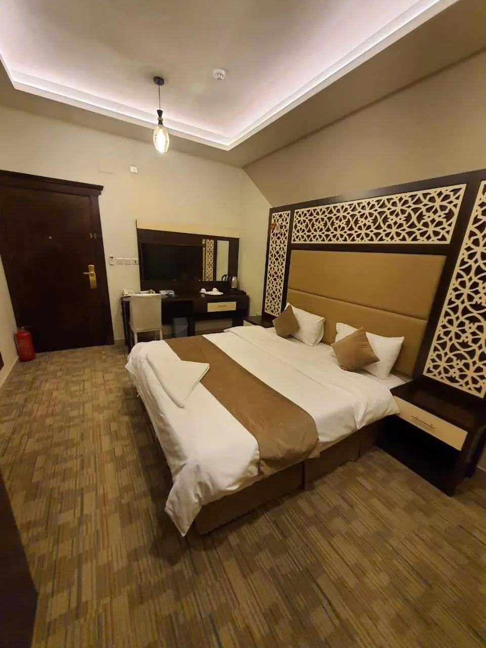 Bed in Arabian Palm Hotel