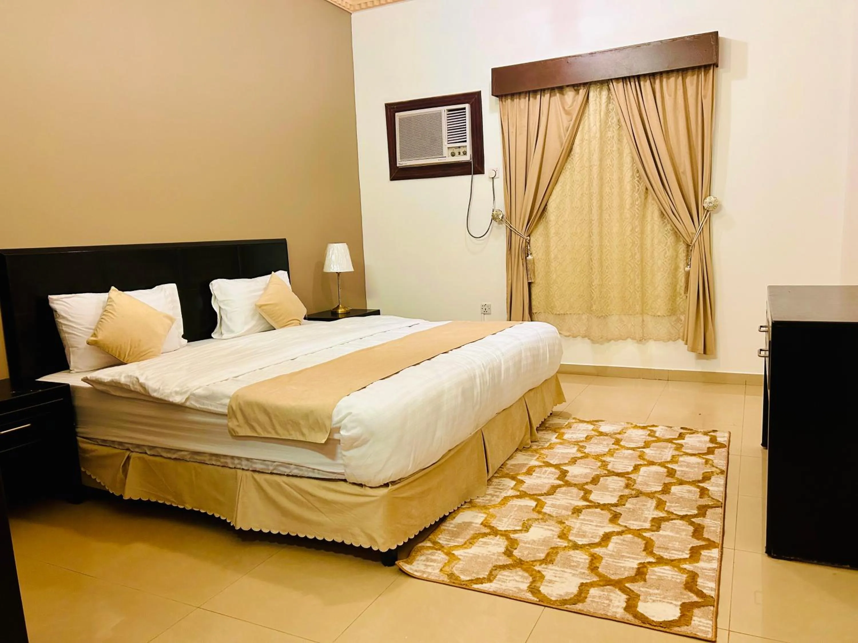 Bed in Arabian Palm Hotel