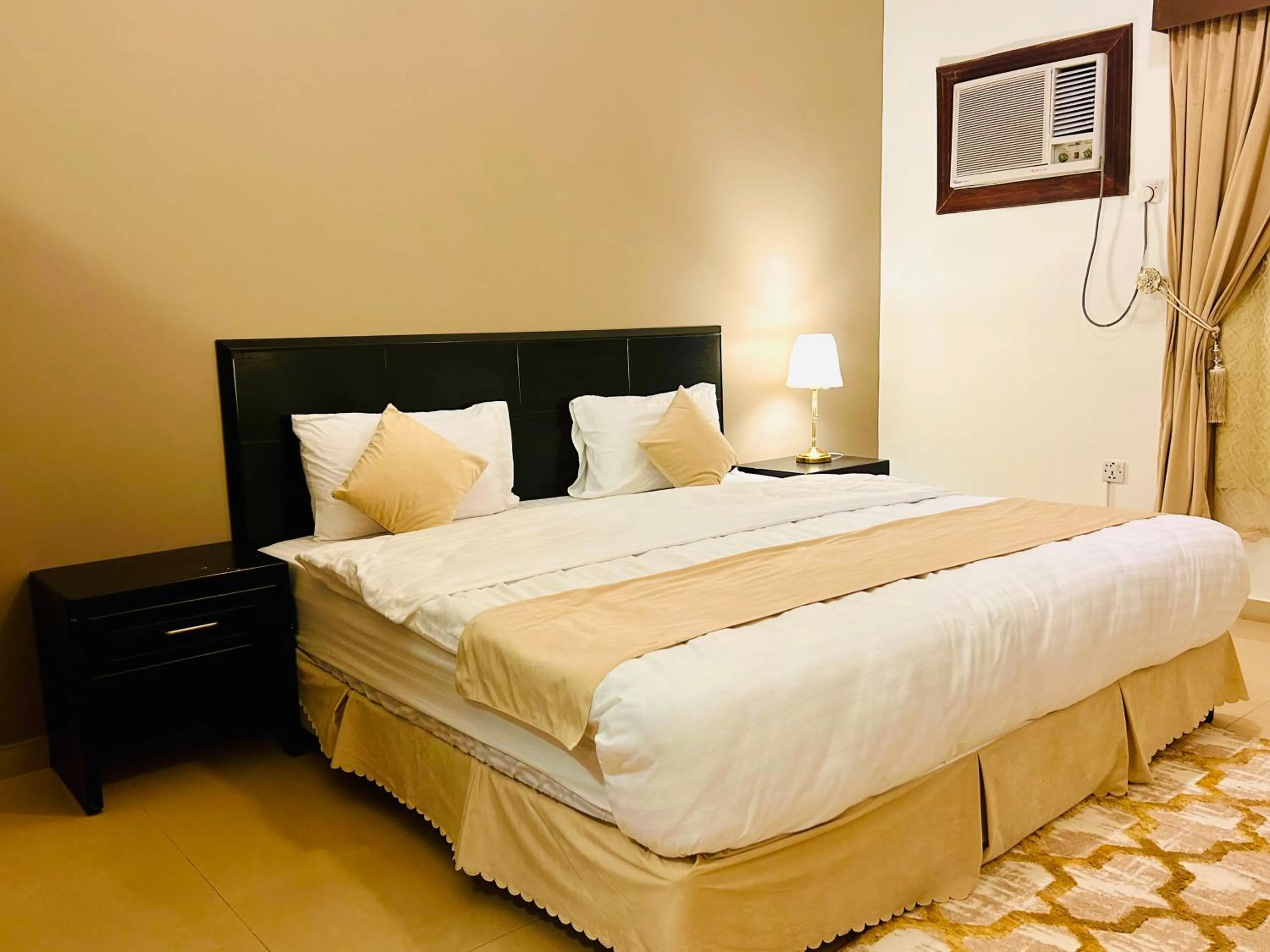 Bed in Arabian Palm Hotel