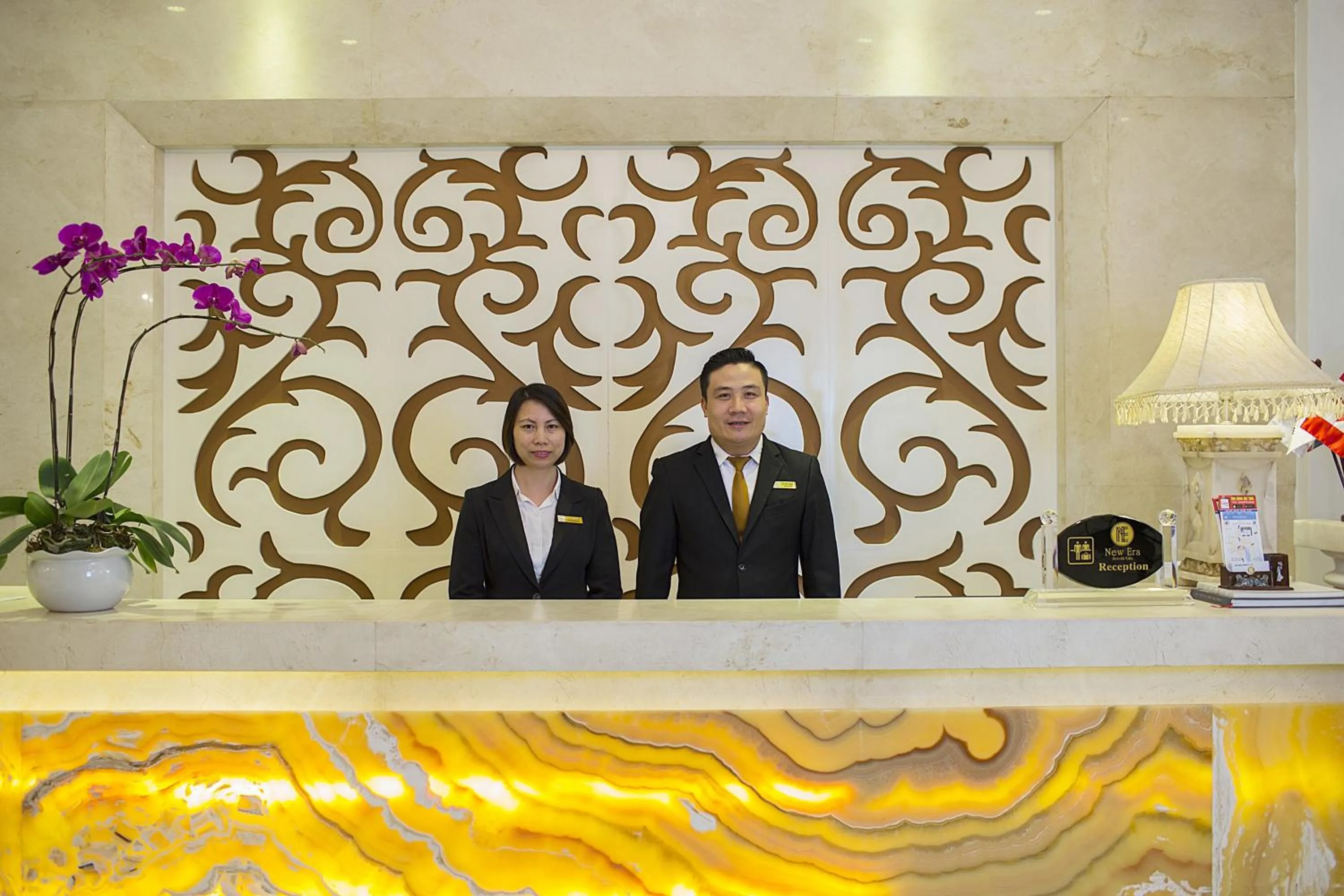 Communal lounge/ TV room, Staff in New Era Hotel & Villa