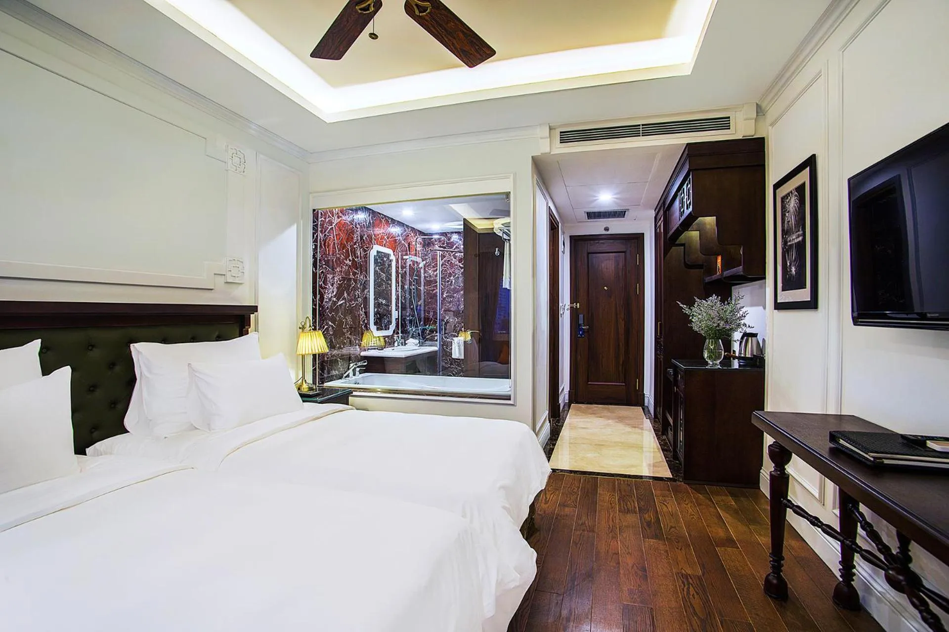 Bed in New Era Hotel & Villa