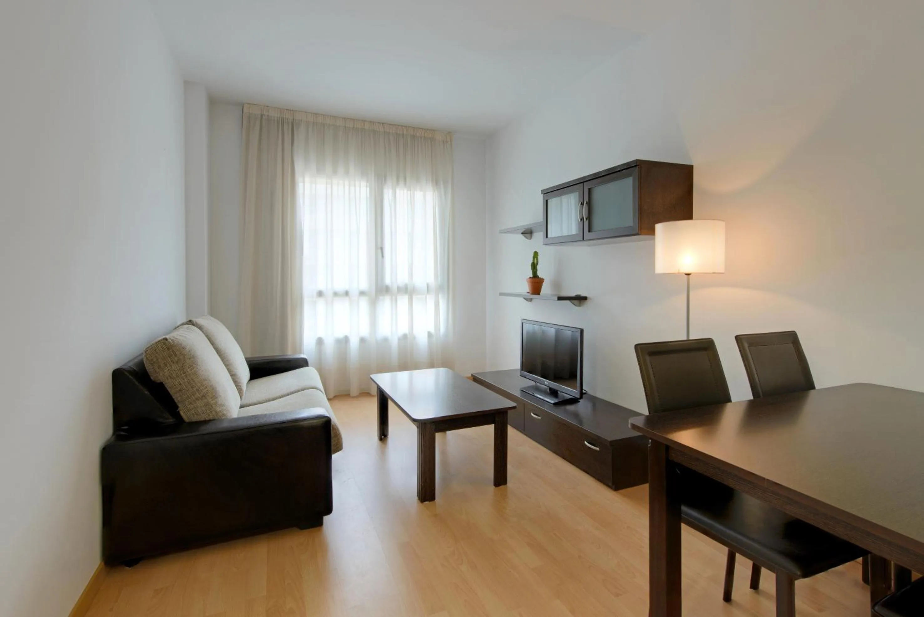 Living room in Madrid Airport Suites, Affiliated by Meliá