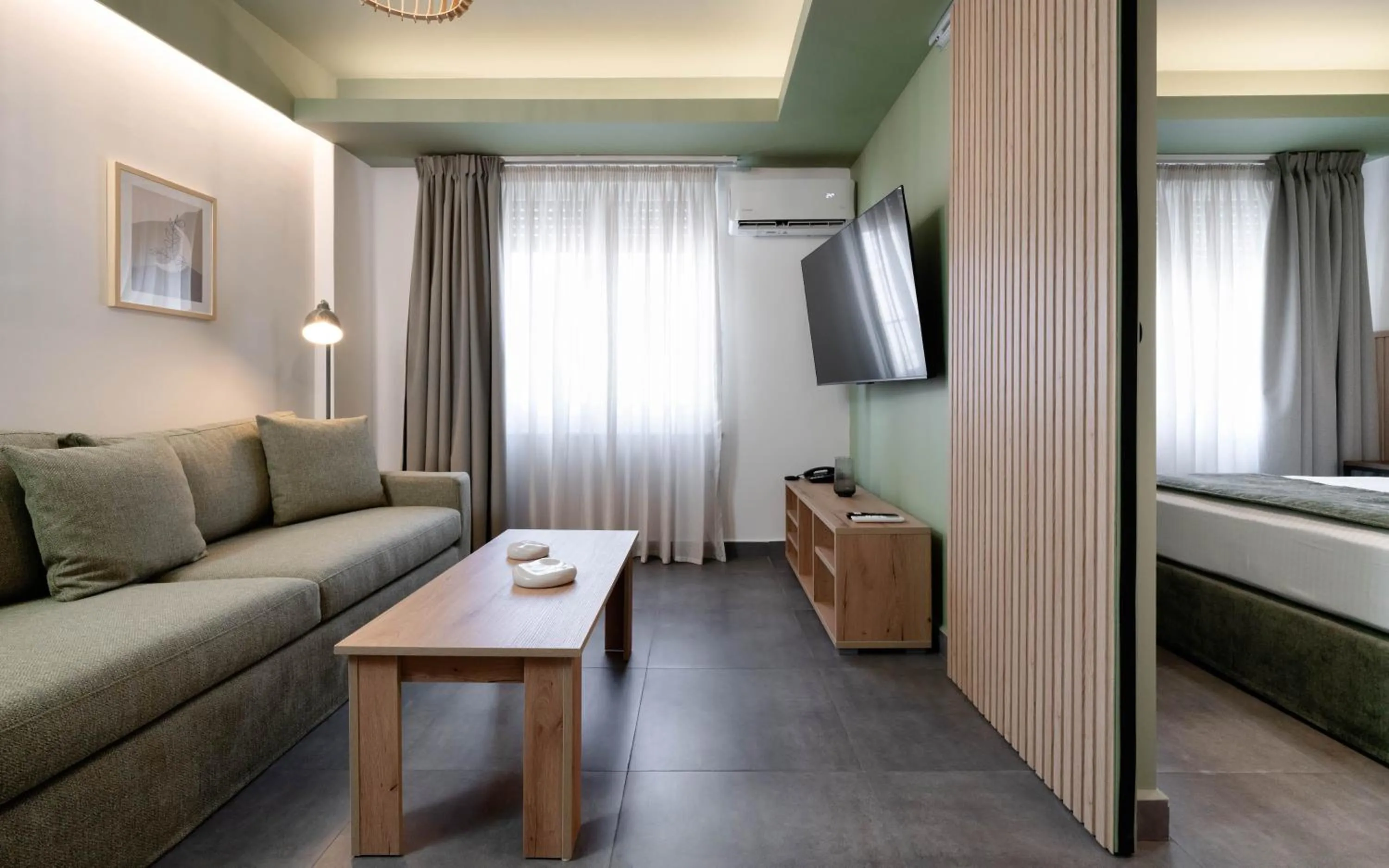 Living room, Bed in Evripidou Suites