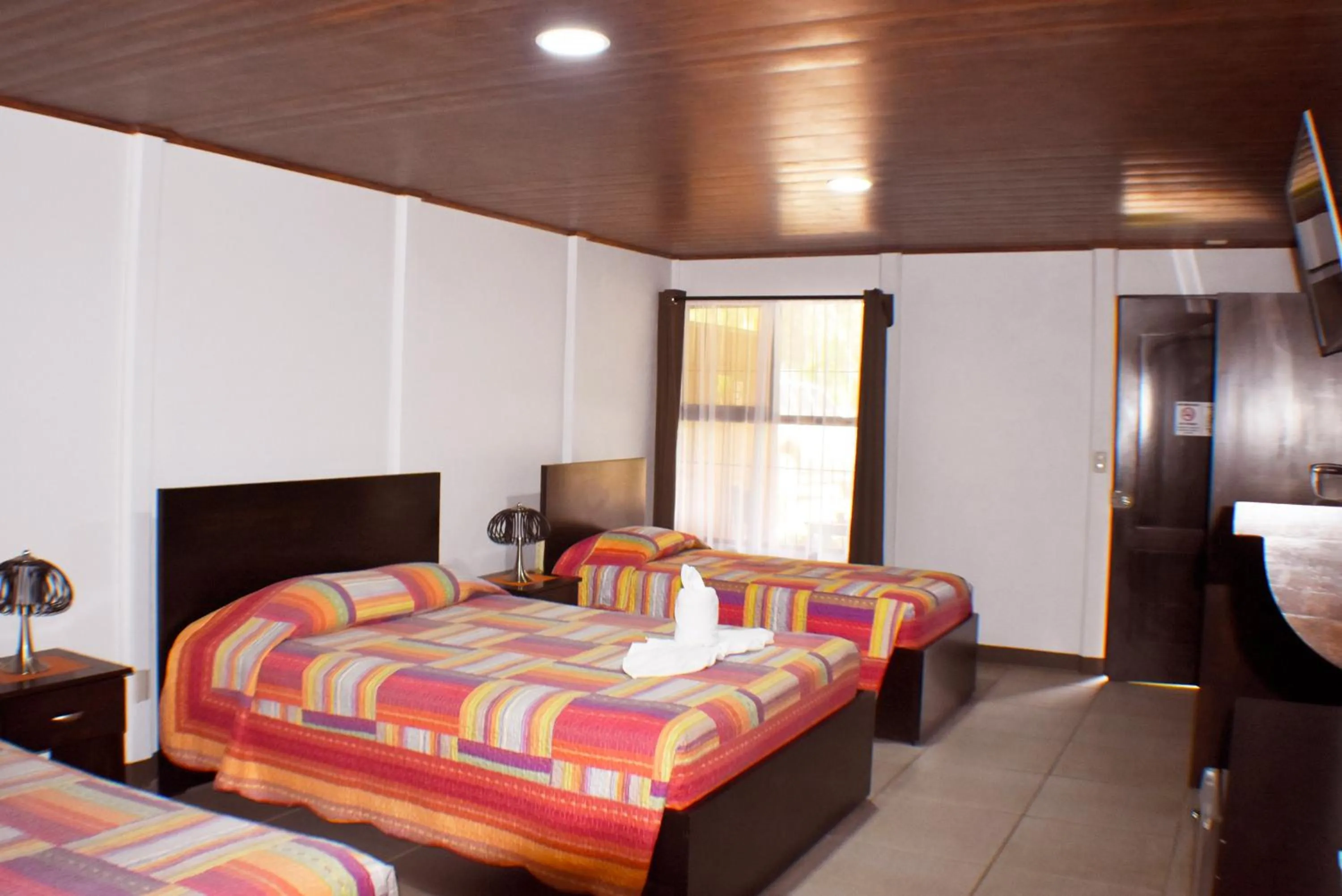 Bed in Hotel Arenal Country Inn