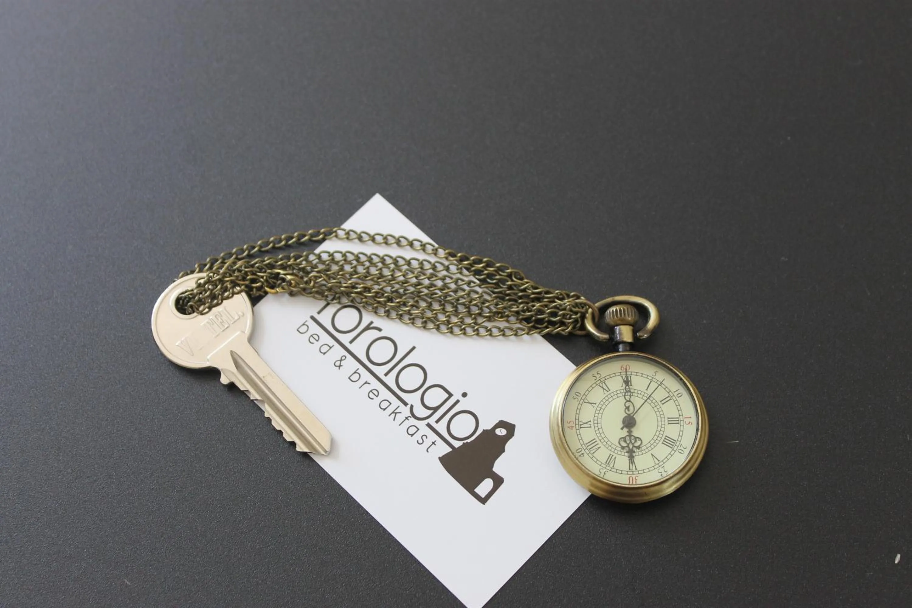 Property logo or sign in L'Orologio Bed & Breakfast