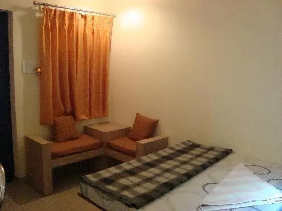Seating area, Bed in Rahul Guest House