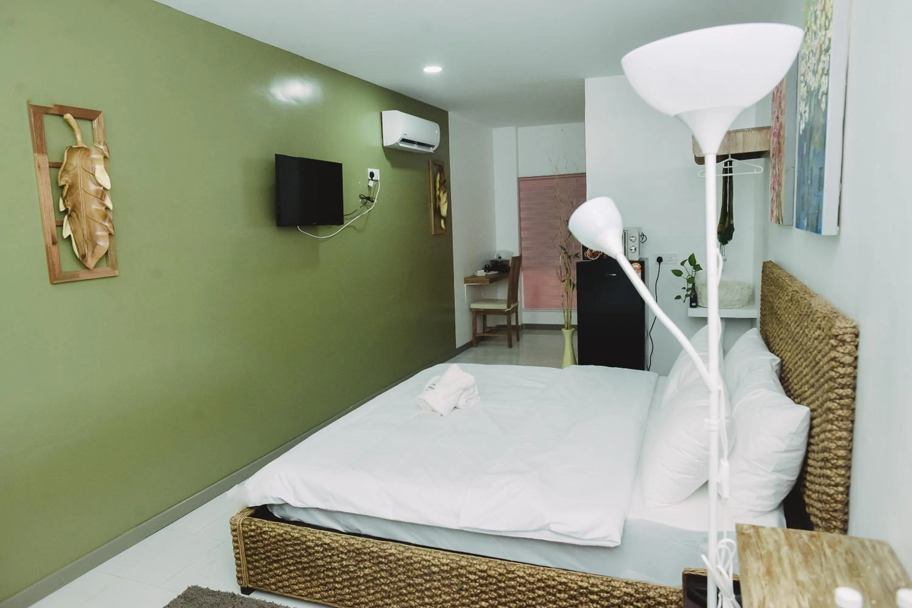 Bed in The Serai Cottage Downtown Hotel