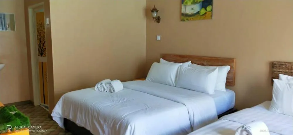 Bed in The Serai Cottage Downtown Hotel