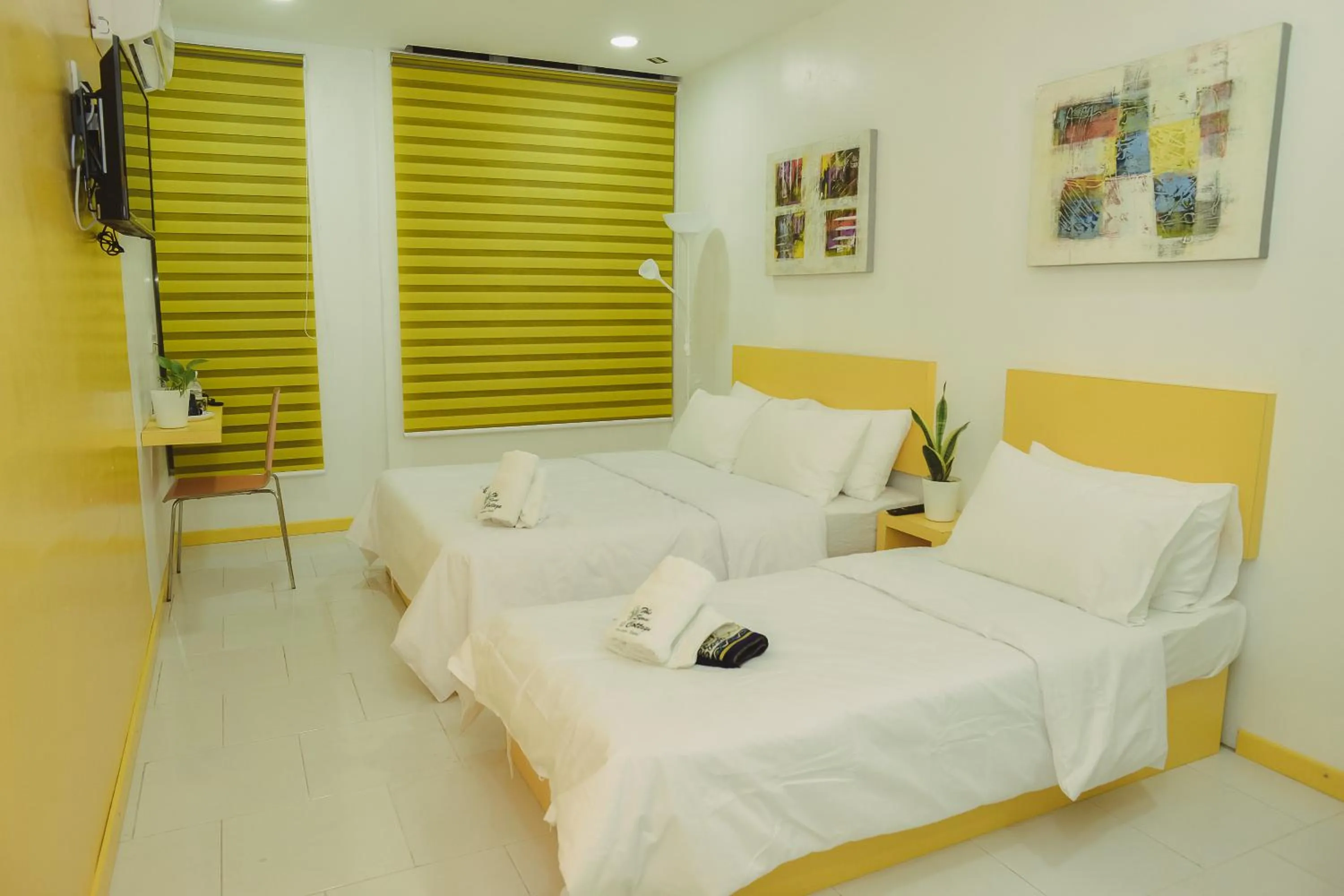 Bed in The Serai Cottage Downtown Hotel