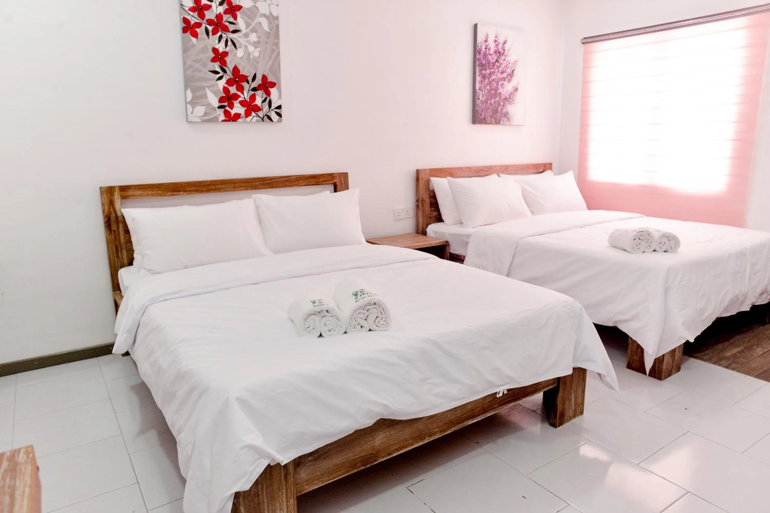 Bed in The Serai Cottage Downtown Hotel