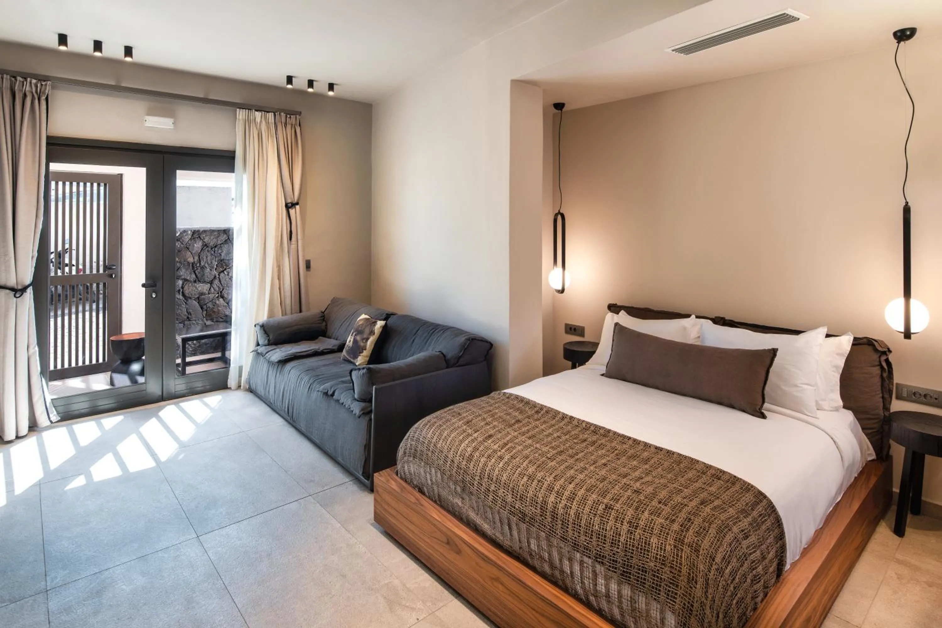 Bed in Uma Ray Suites