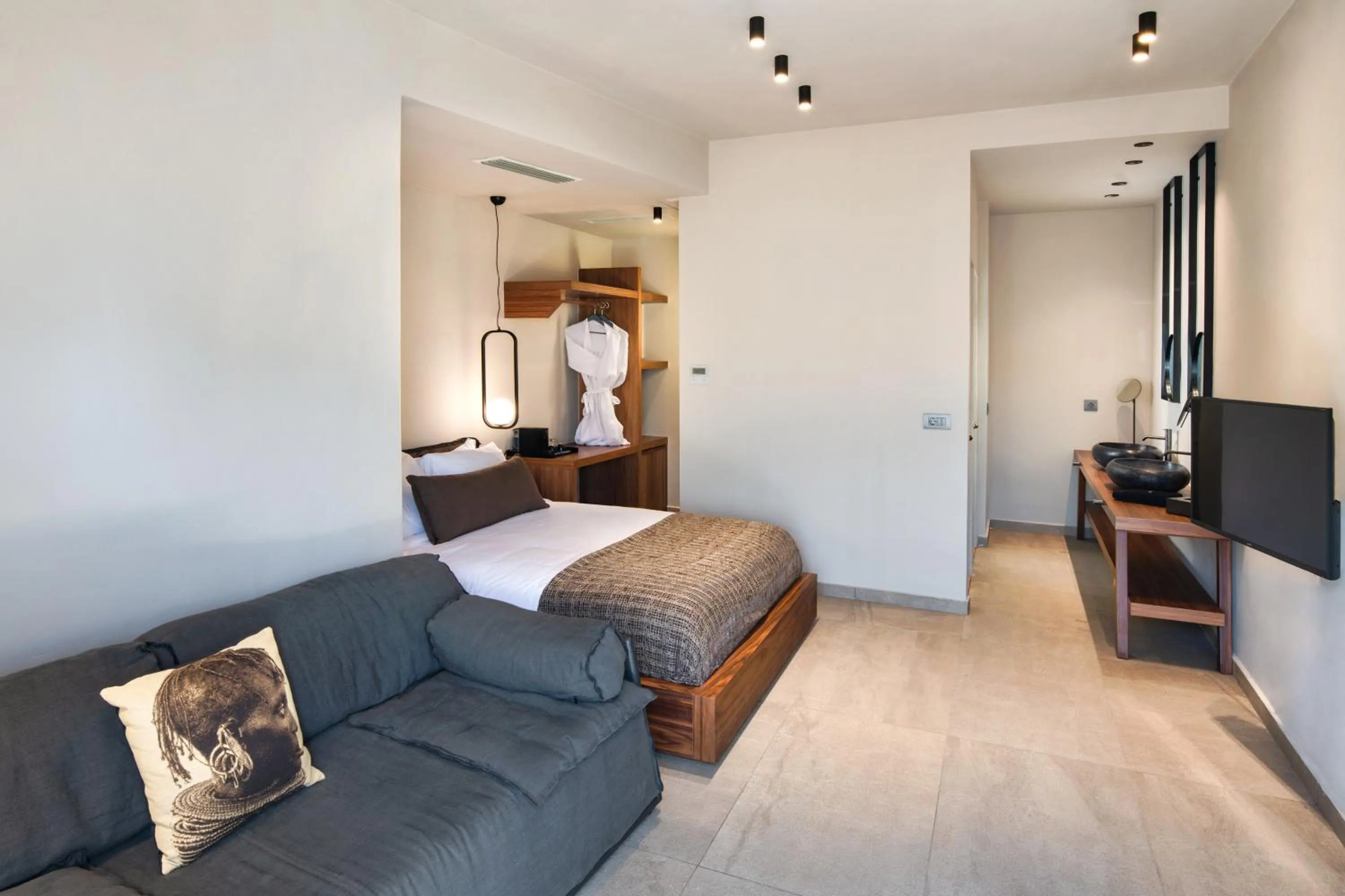 Bed in Uma Ray Suites