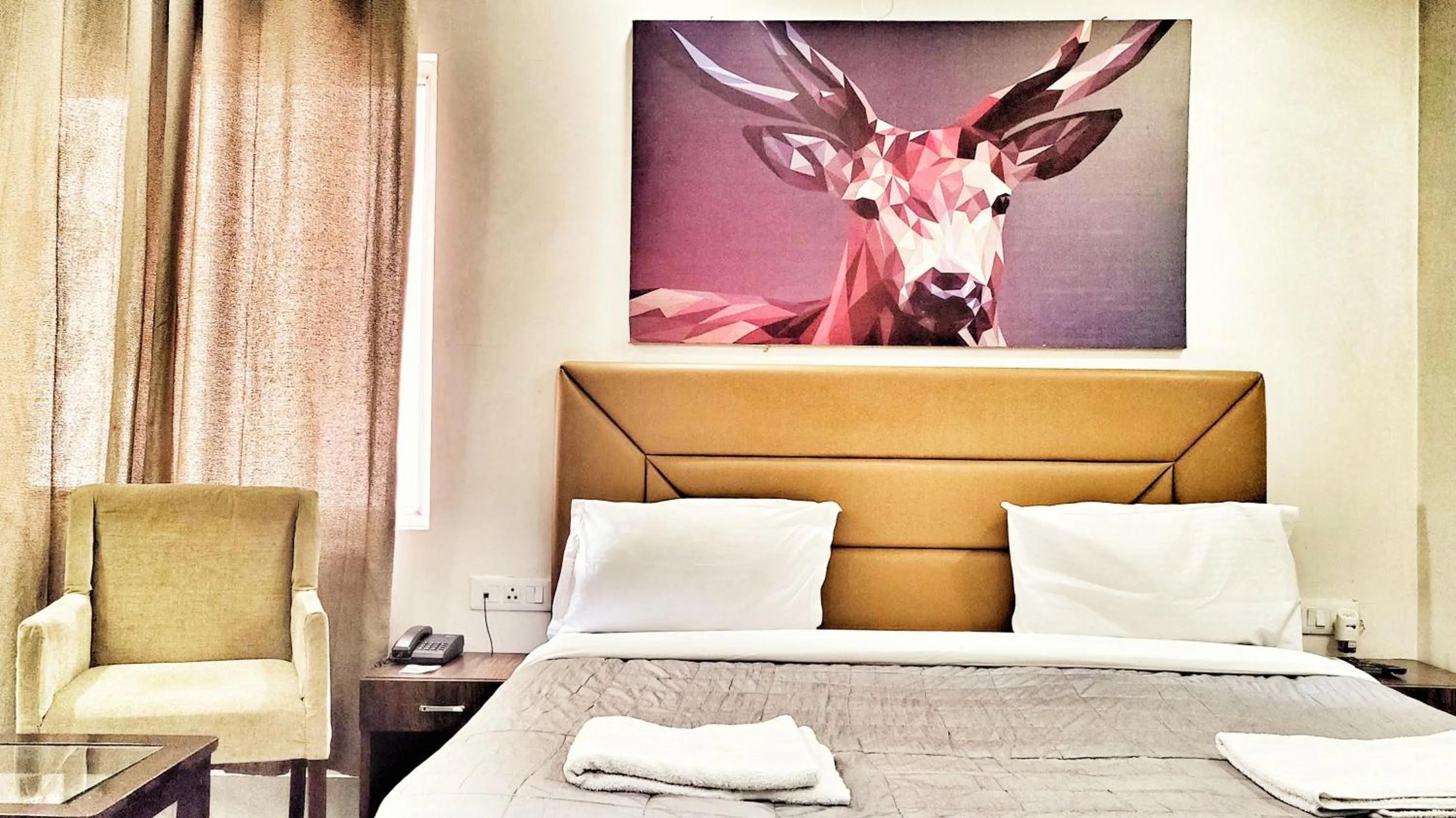 View (from property/room), Bed in Hotel Aerocity Purple Orchid