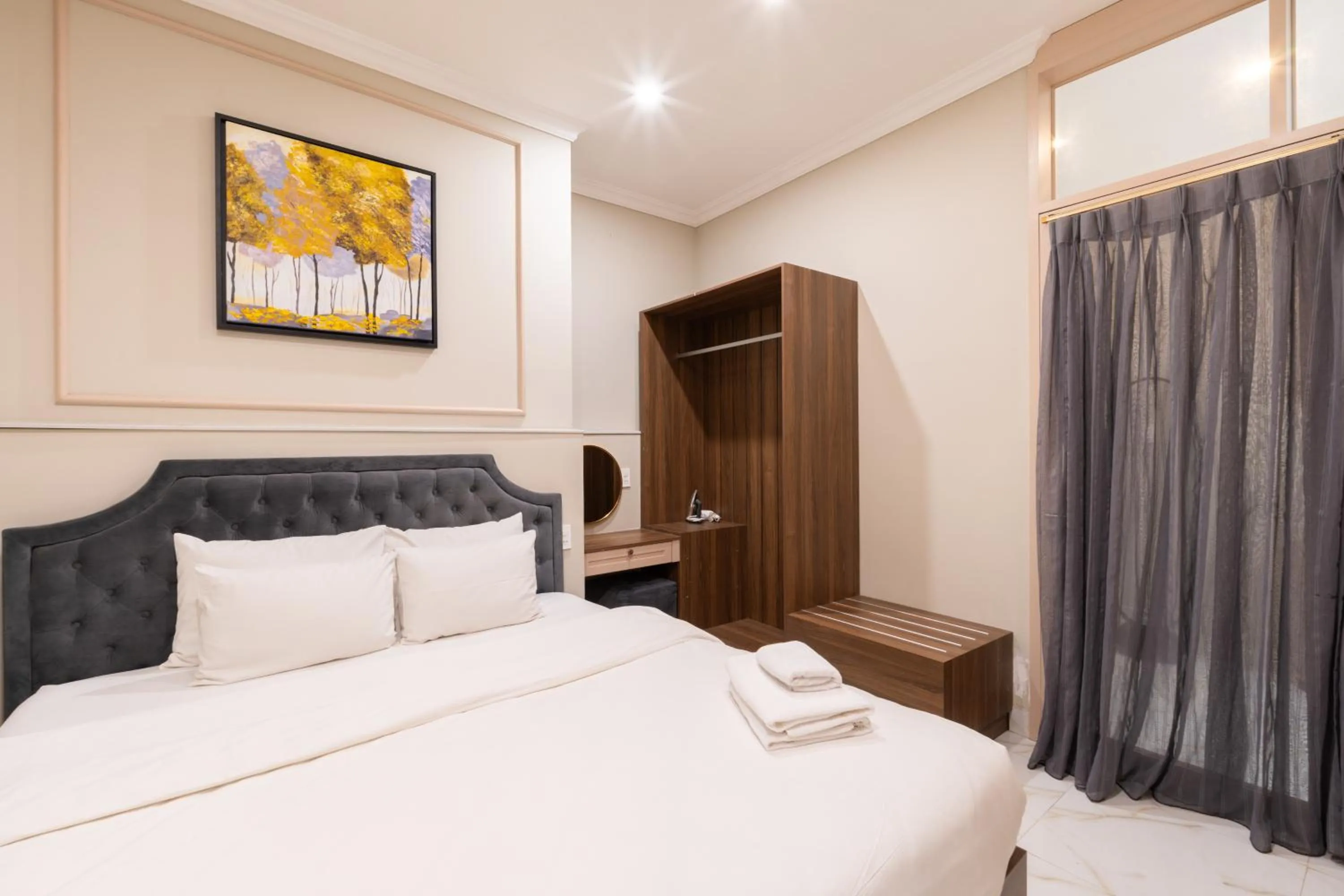 Bed in N Queen Apartment Hotel