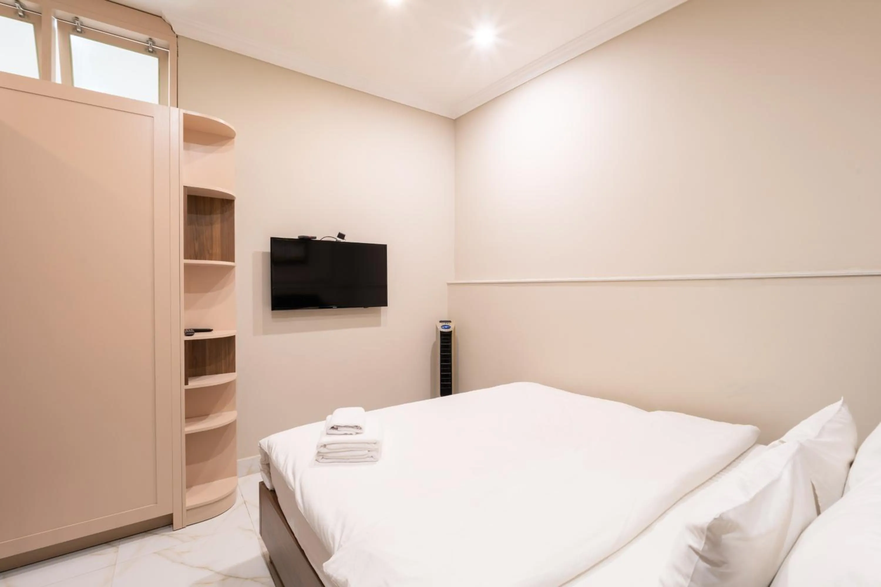 Bed in N Queen Apartment Hotel