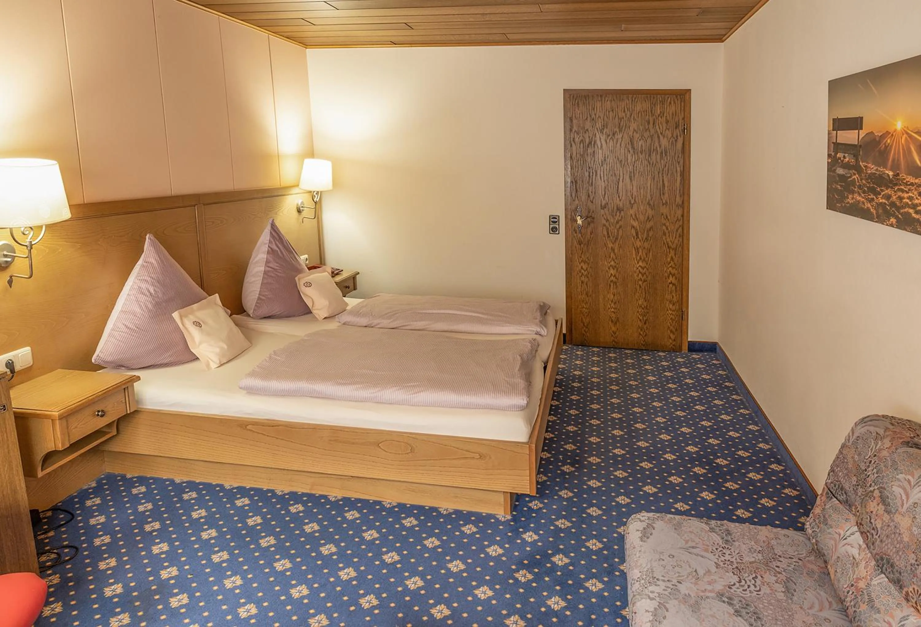 Bed in Sporthotel Göbel Garni