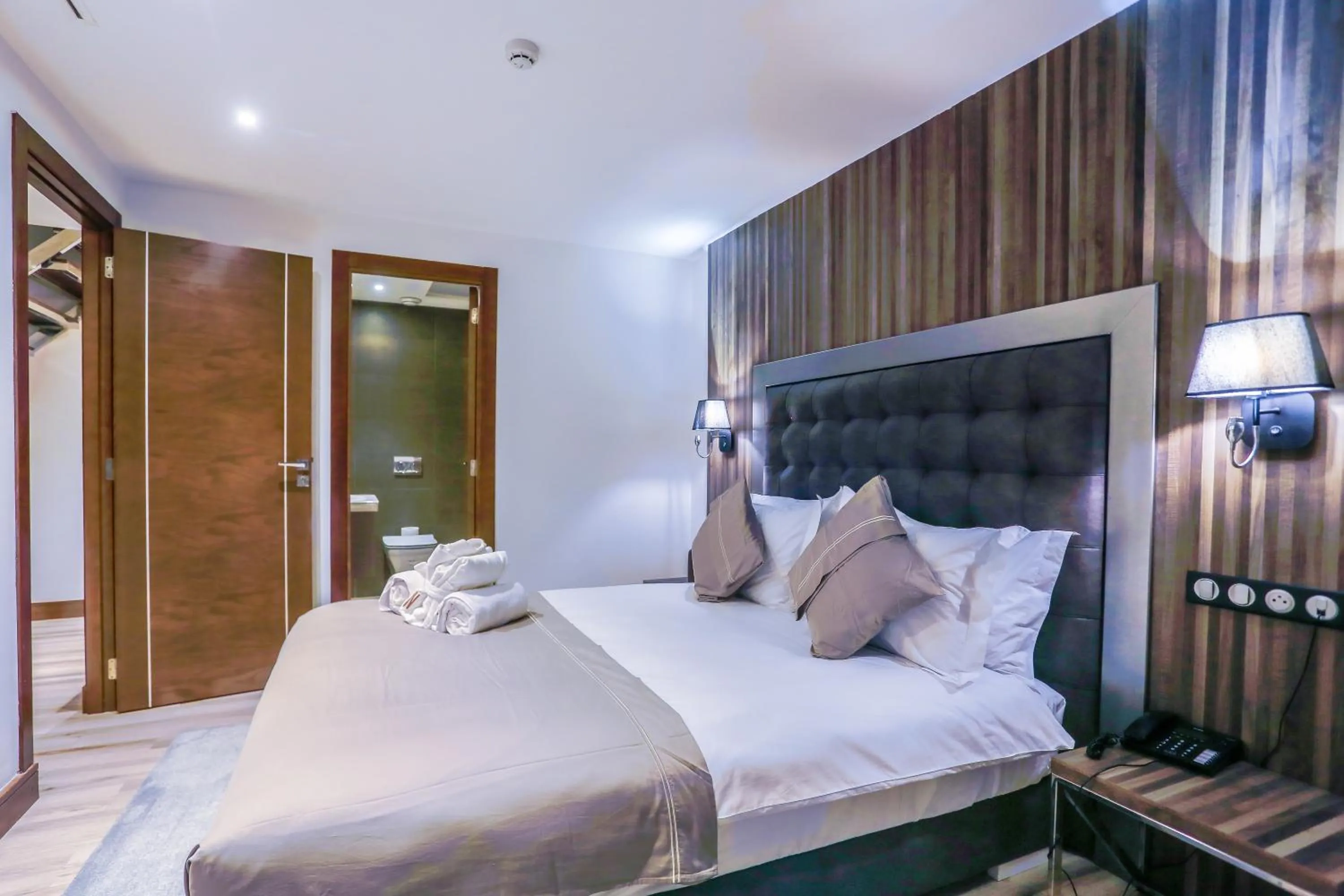 Bed in SBN Suite Hôtel