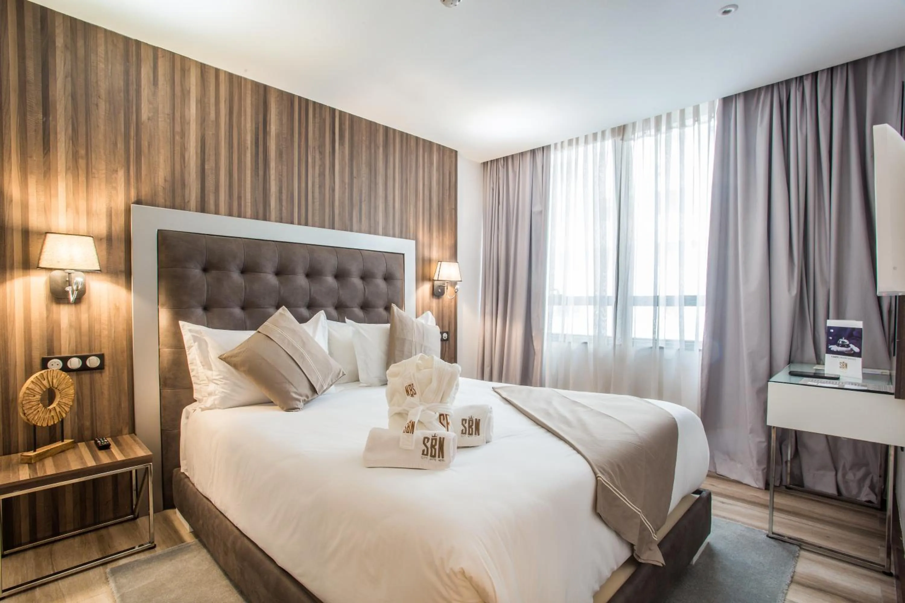 Bed in SBN Suite Hôtel